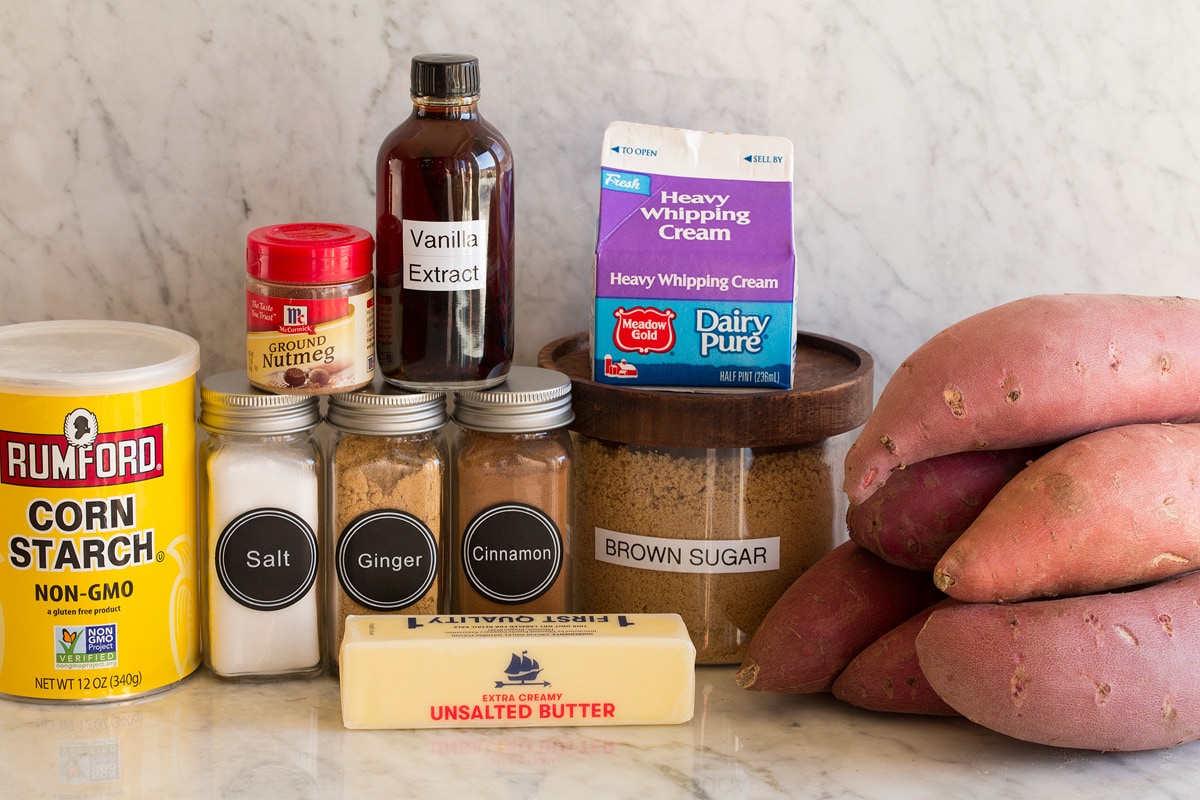 Candied Yams Image of ingredients used to make candied yams. Includes sweet potatoes, brown sugar, cream, butter, cinnamon, nutmeg, ginger, salt, vanilla and cornstarch.