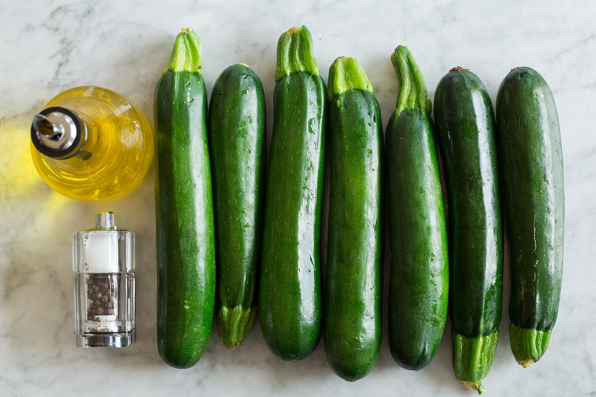 Zucchini Noodles - Zoodles Image of ingredients used to make zucchini noodles. Includes fresh zucchini, olive oil, salt and pepper.