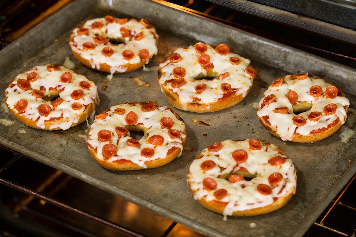 Pizza Bagels Pizza bagels toasting in the oven.