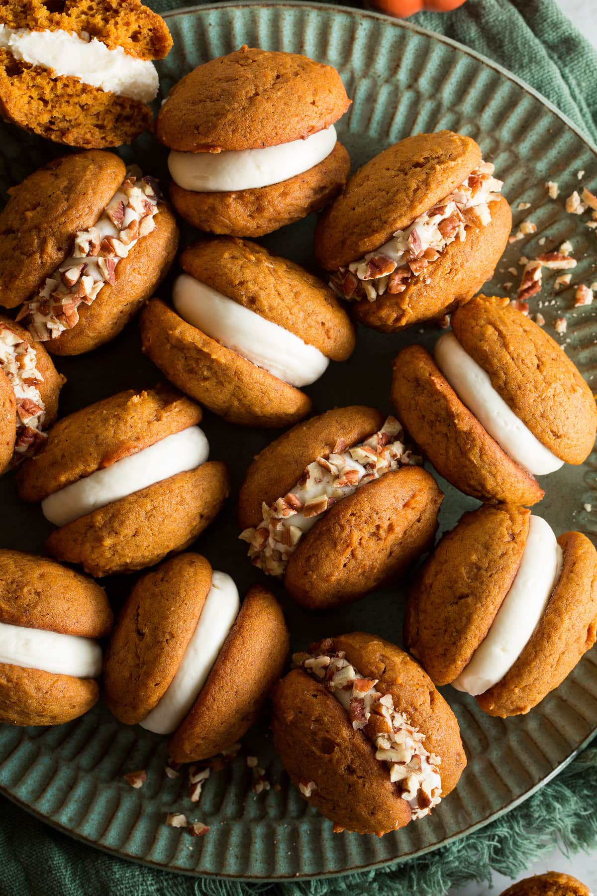 Pumpkin Whoopie Pies Close up photo of pumpkin whoopie pies with cream cheese frosting filling.