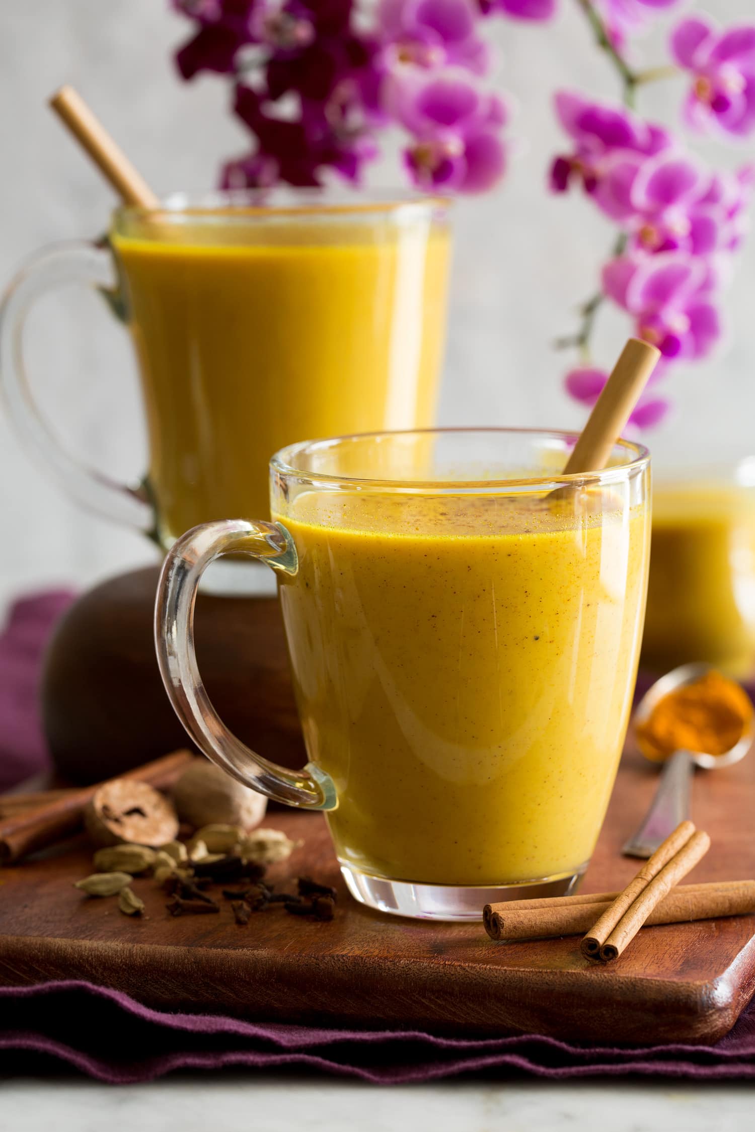 Golden Milk Turmeric milk in clear glass mugs.
