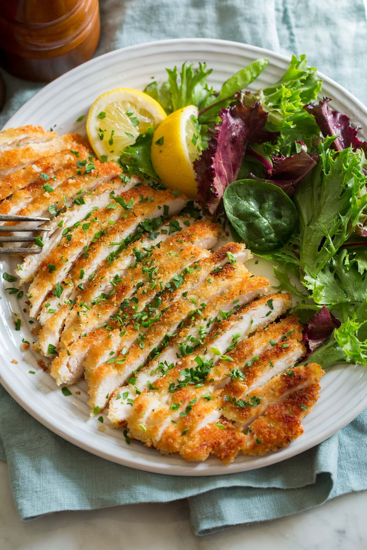 Sliced thin chicken schnitzel.