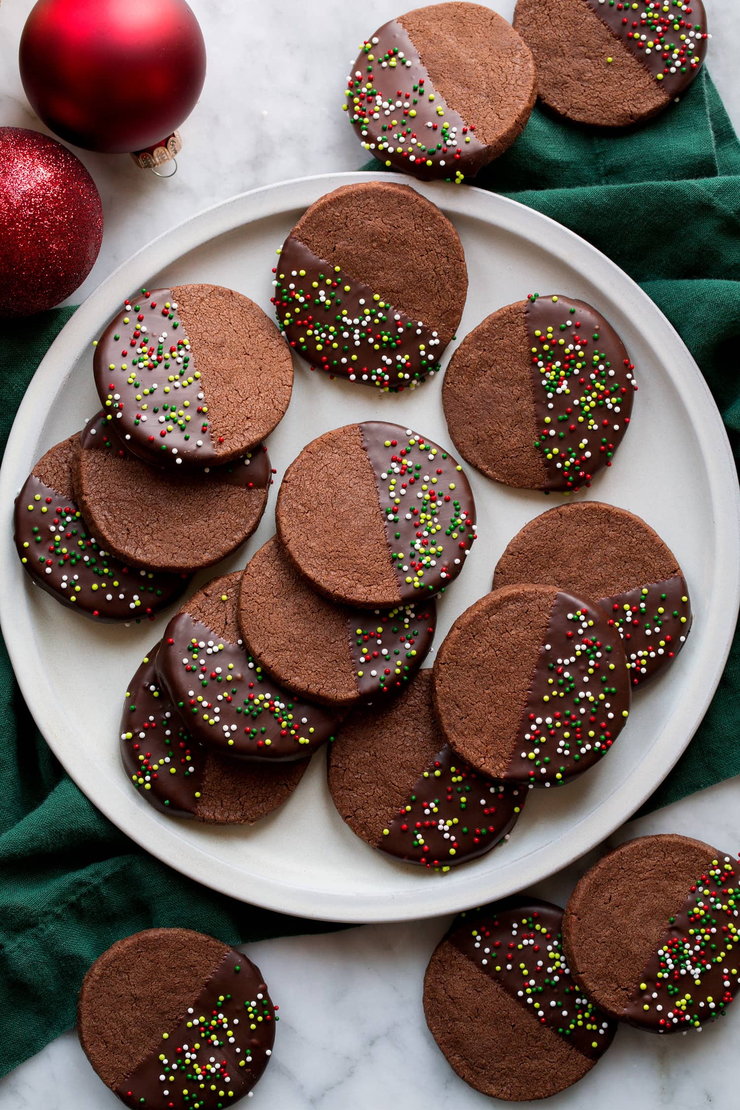 Chocolate Shortbread Cookies Overhead photo of chocolate dipped chocolate cookies with sprinkles.
