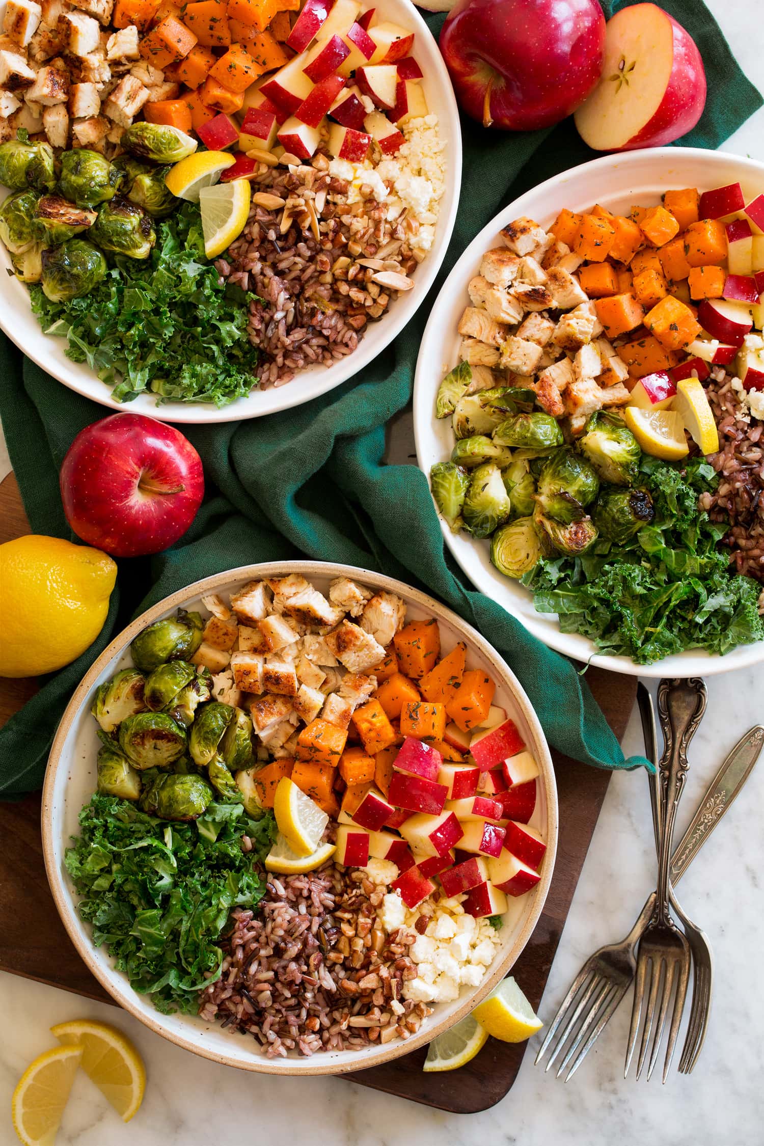 Harvest Bowl Harvest bowls with sweet potatoes, kale, chicken, nuts, feta, apples and wild rice.
