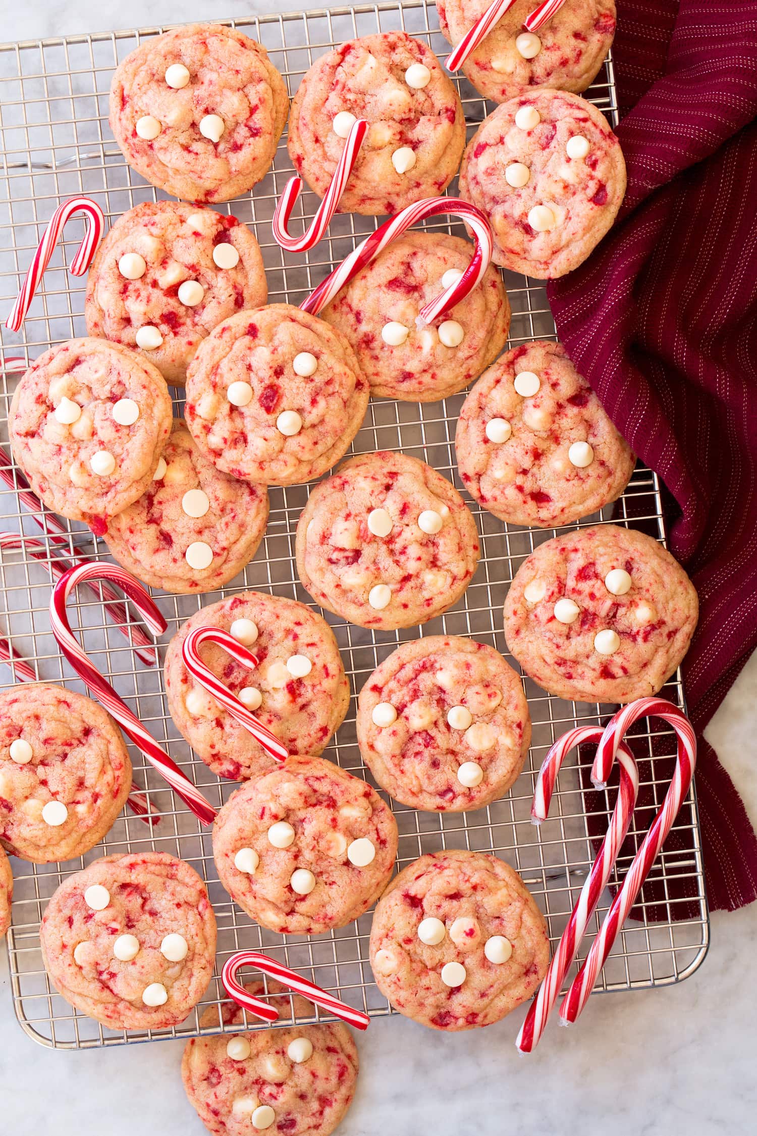 Peppermint White Chocolate Chip Cookies Peppermint cookies cooling on wire rack.