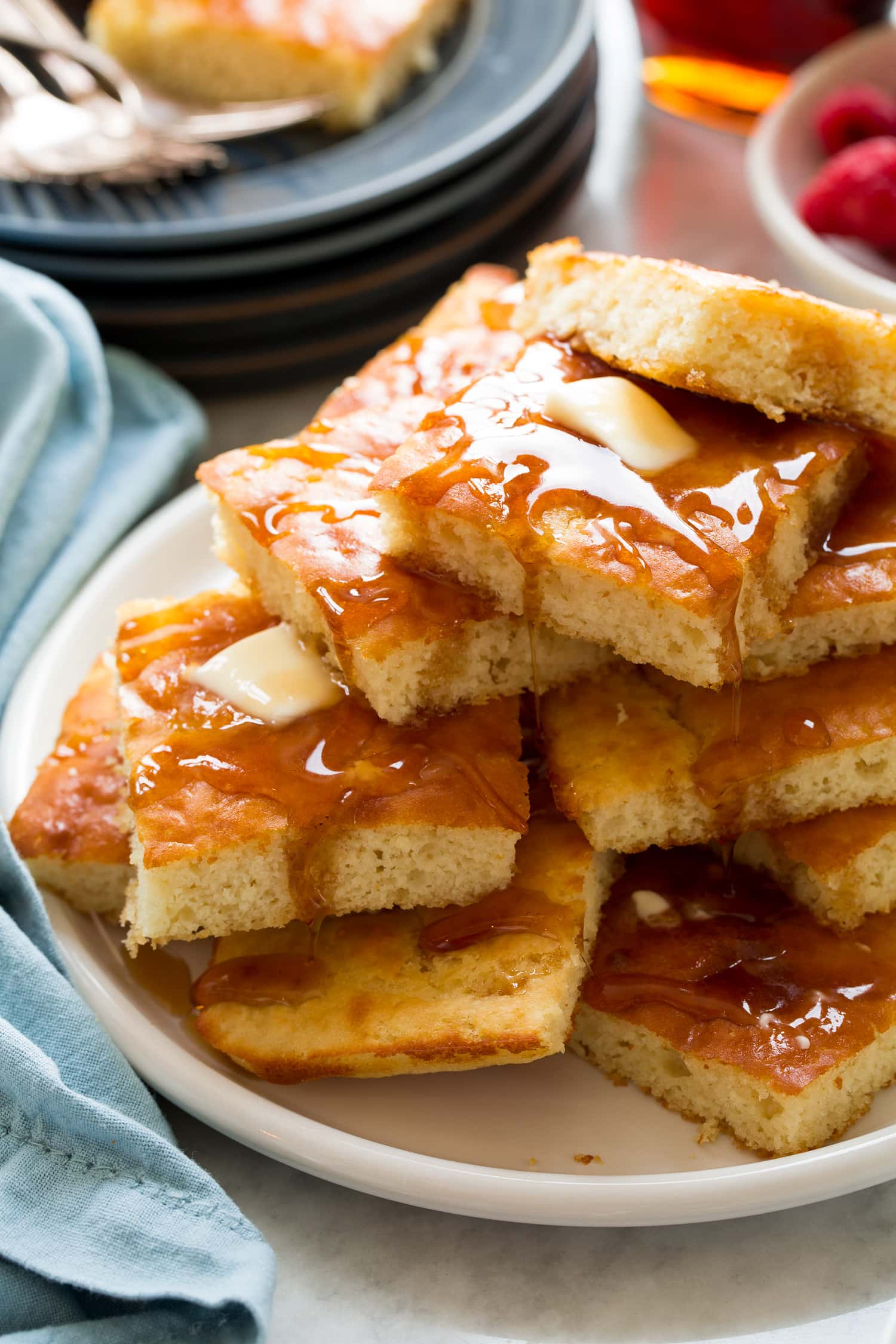 Sheet Pan Pancakes Tall stack of sheet pan pancakes shown close up.