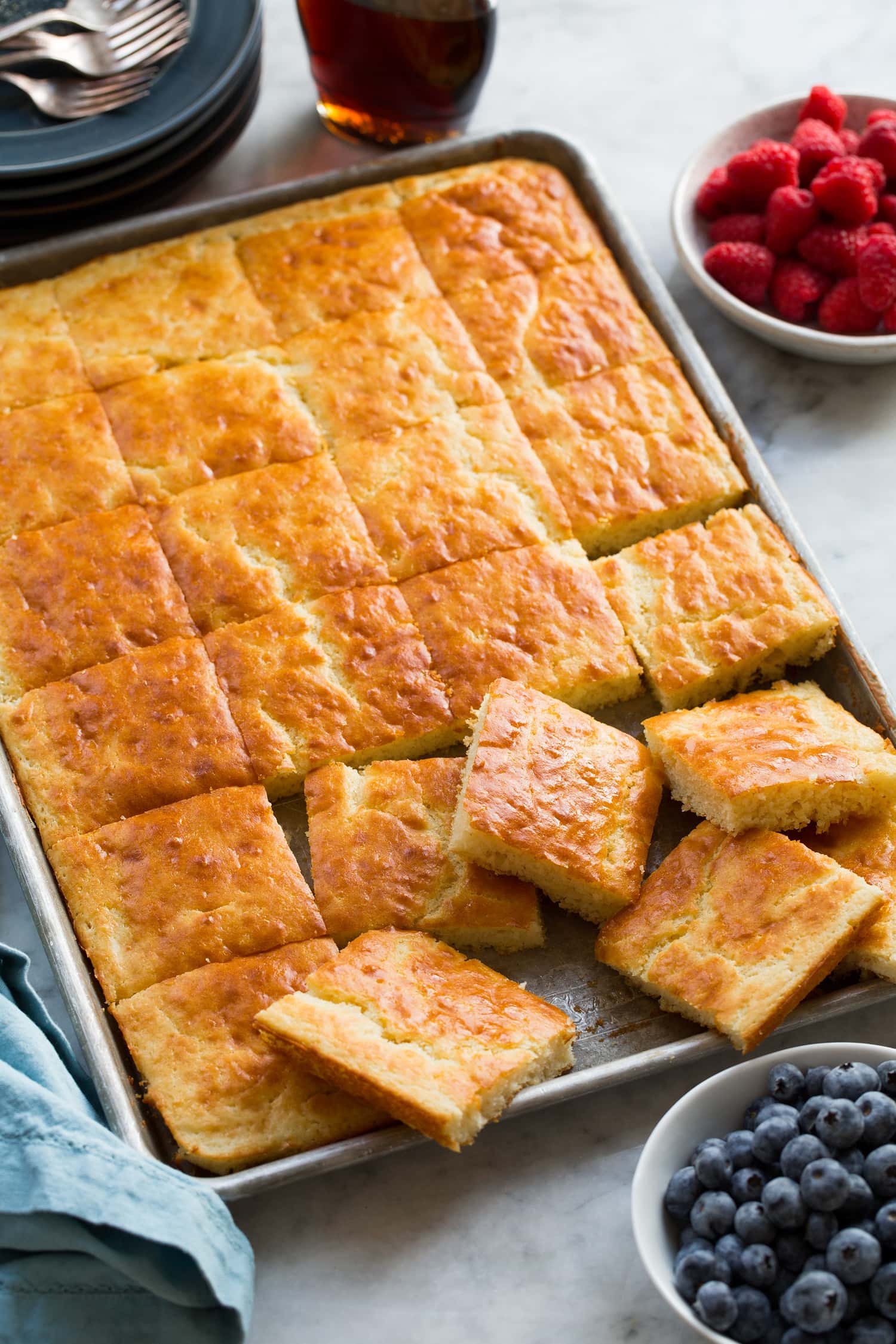 Sheet Pan Pancakes Pancakes shown cut into squares in baking sheet.