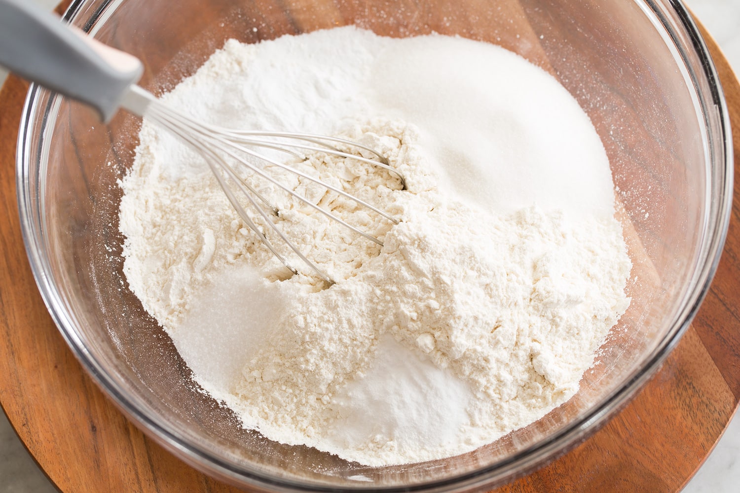 Sheet Pan Pancakes Mixing dry ingredients for pancake mix.