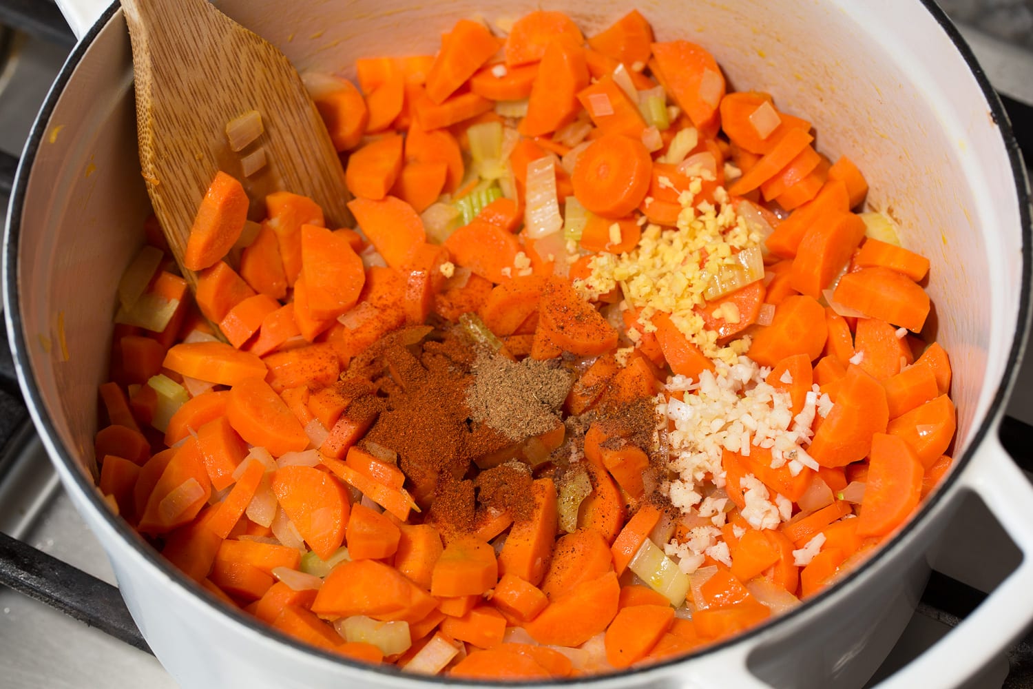 Carrot Soup Spices, garlic and ginger added to sauteed vegetables.