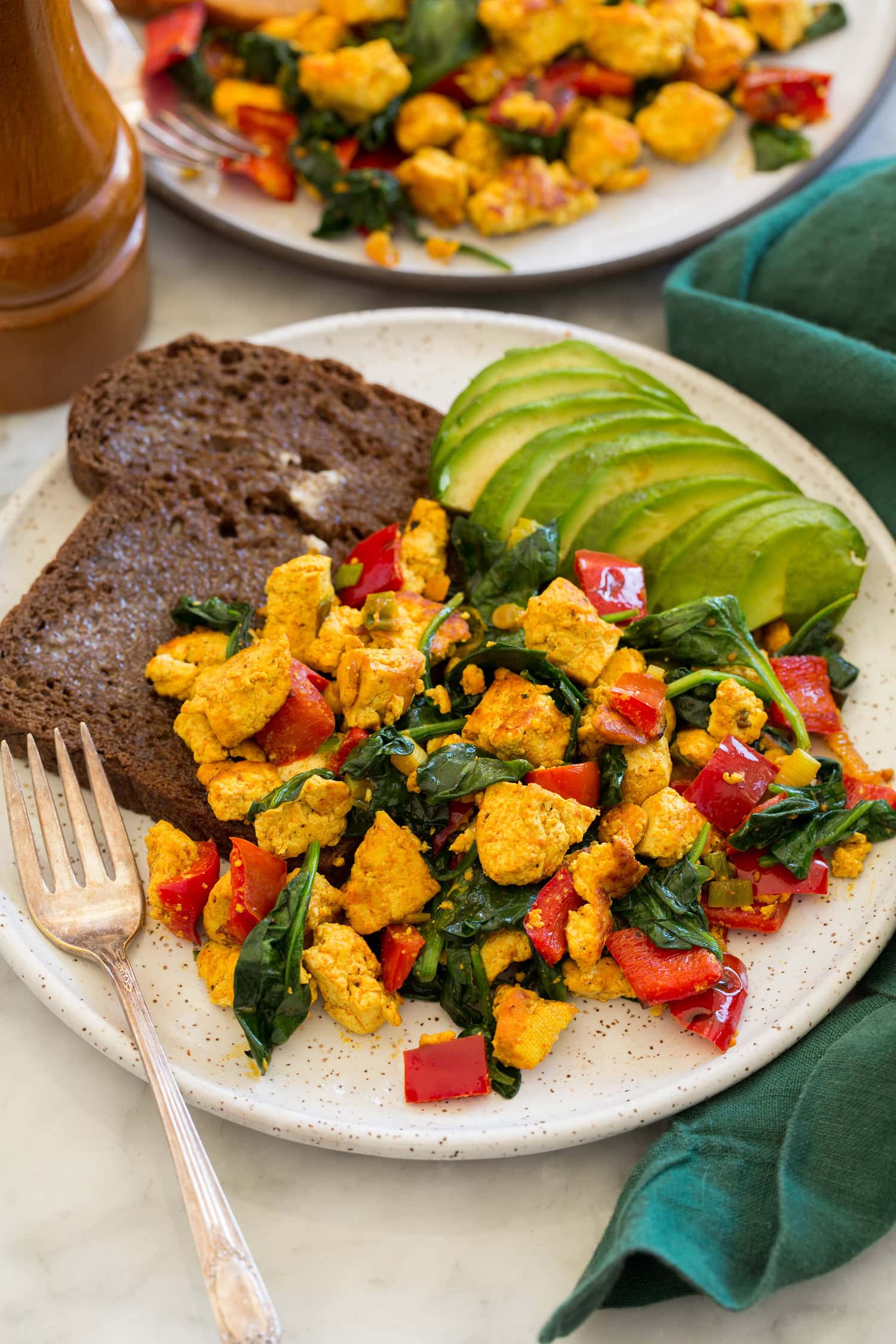 Tofu Scramble Tofu scramble shown with serving suggestions of avocado and whole grain toast.