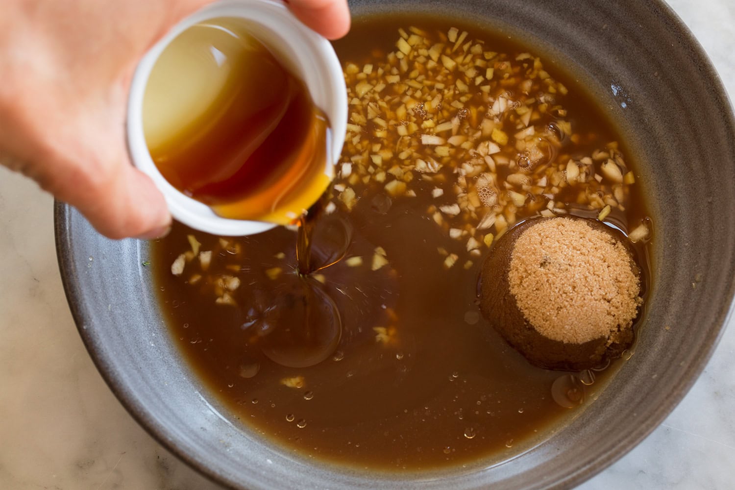Making homemade vegan teriyaki sauce.