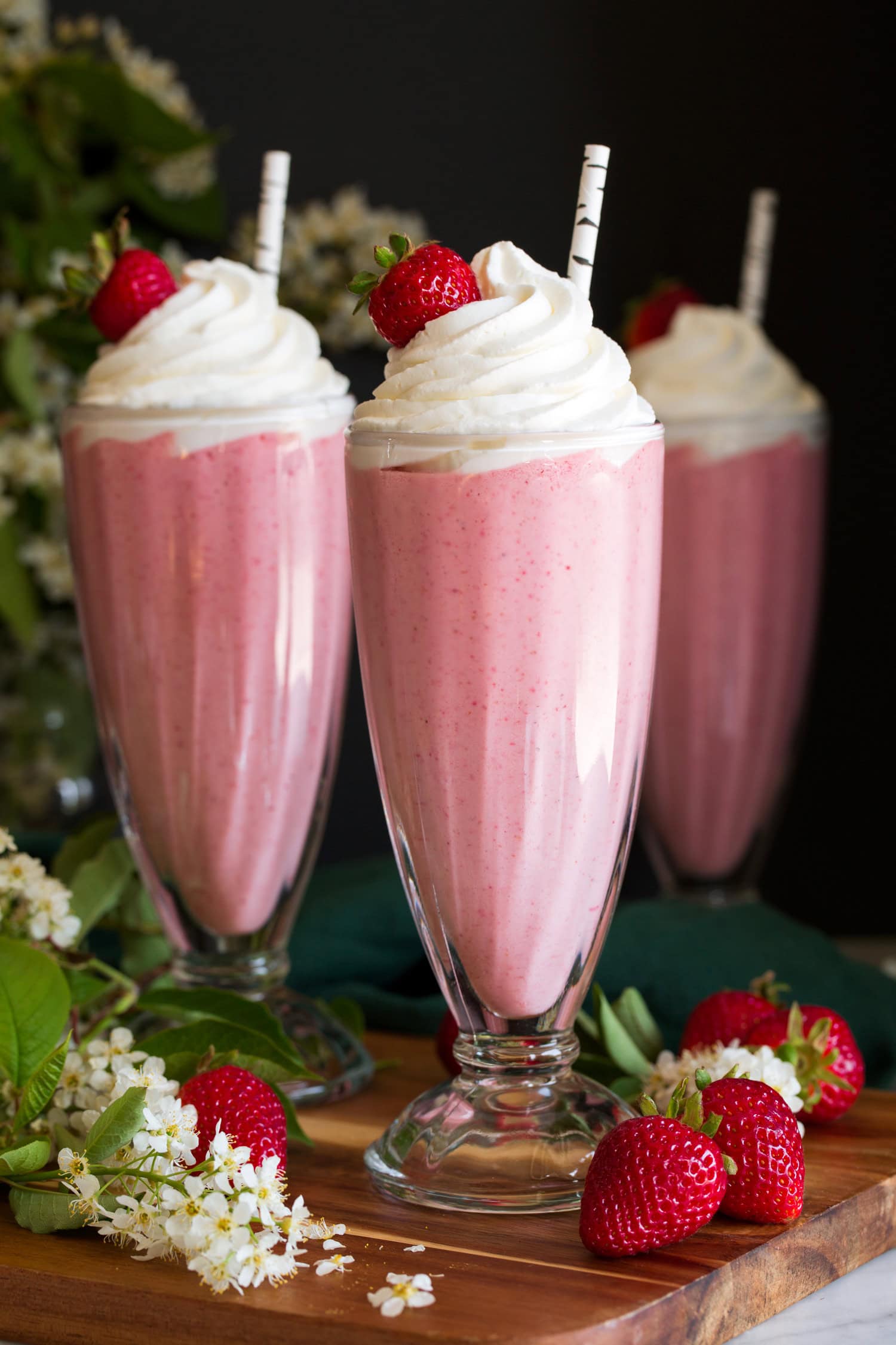 Strawberry Milkshakes Close up photo of three strawberry milkshakes.
