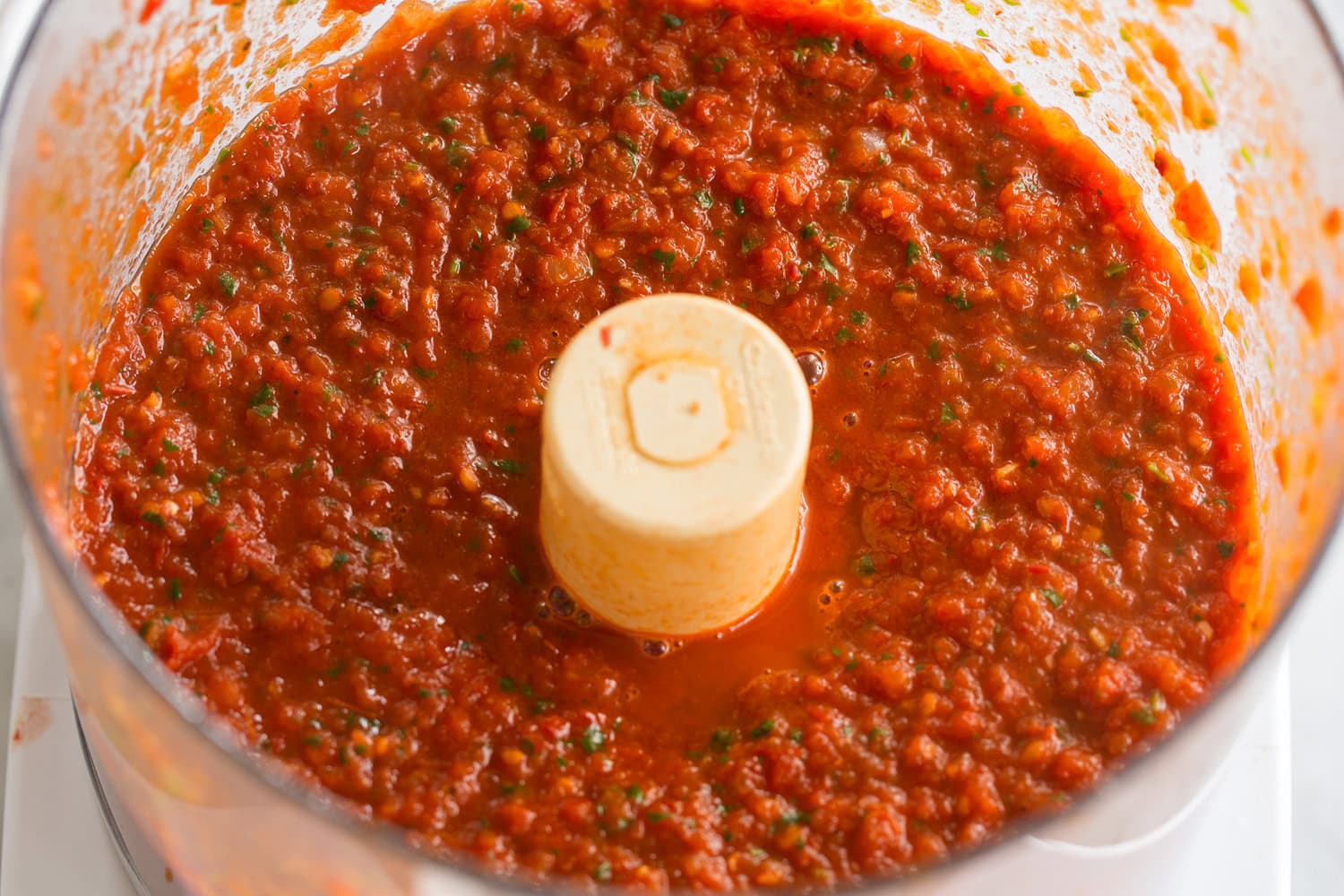 Huevos Rancheros Completed salsa ranchera sauce for huevos rancheros, shown in food processor.