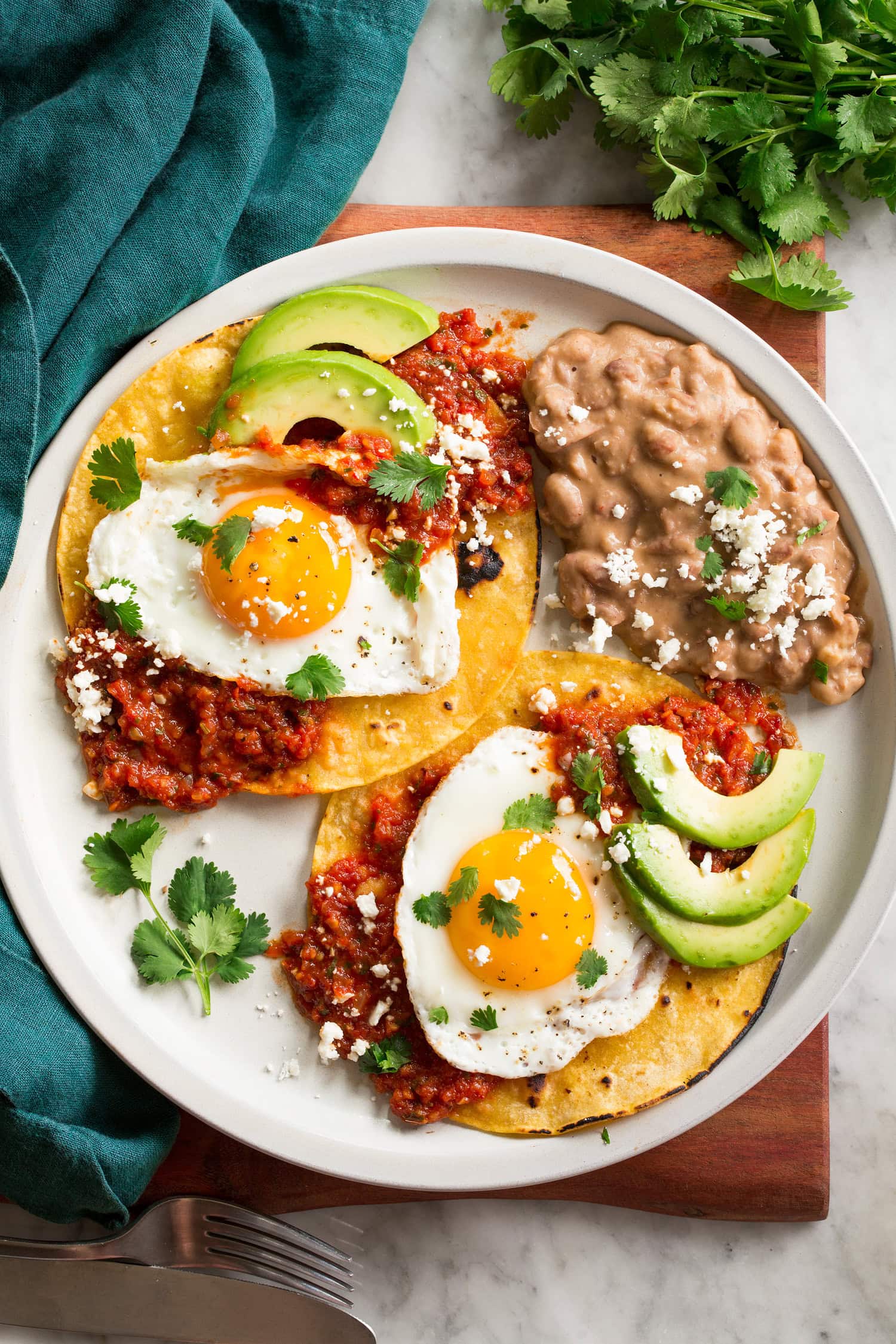 Huevos Rancheros Huevos rancheros shown with a serving suggestion of side of refried beans.