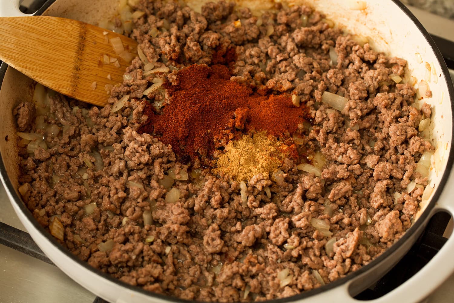 Taco Pasta Adding spices to browned beef.