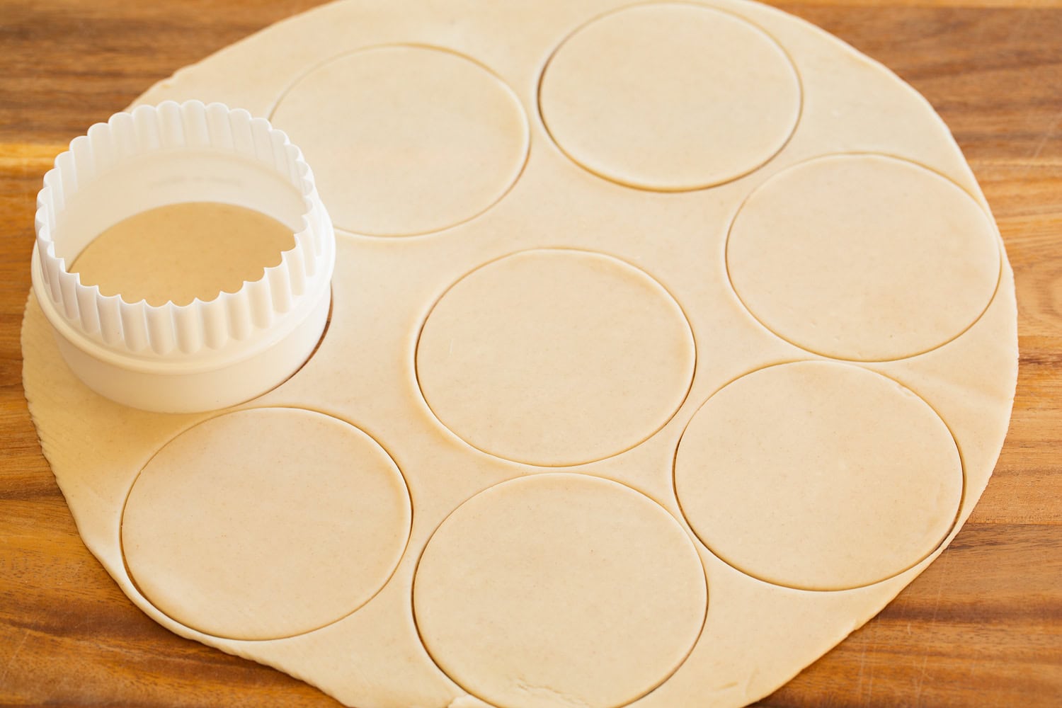 Mini Pumpkin Pies Pie crust cut into individual circles for muffin pan.