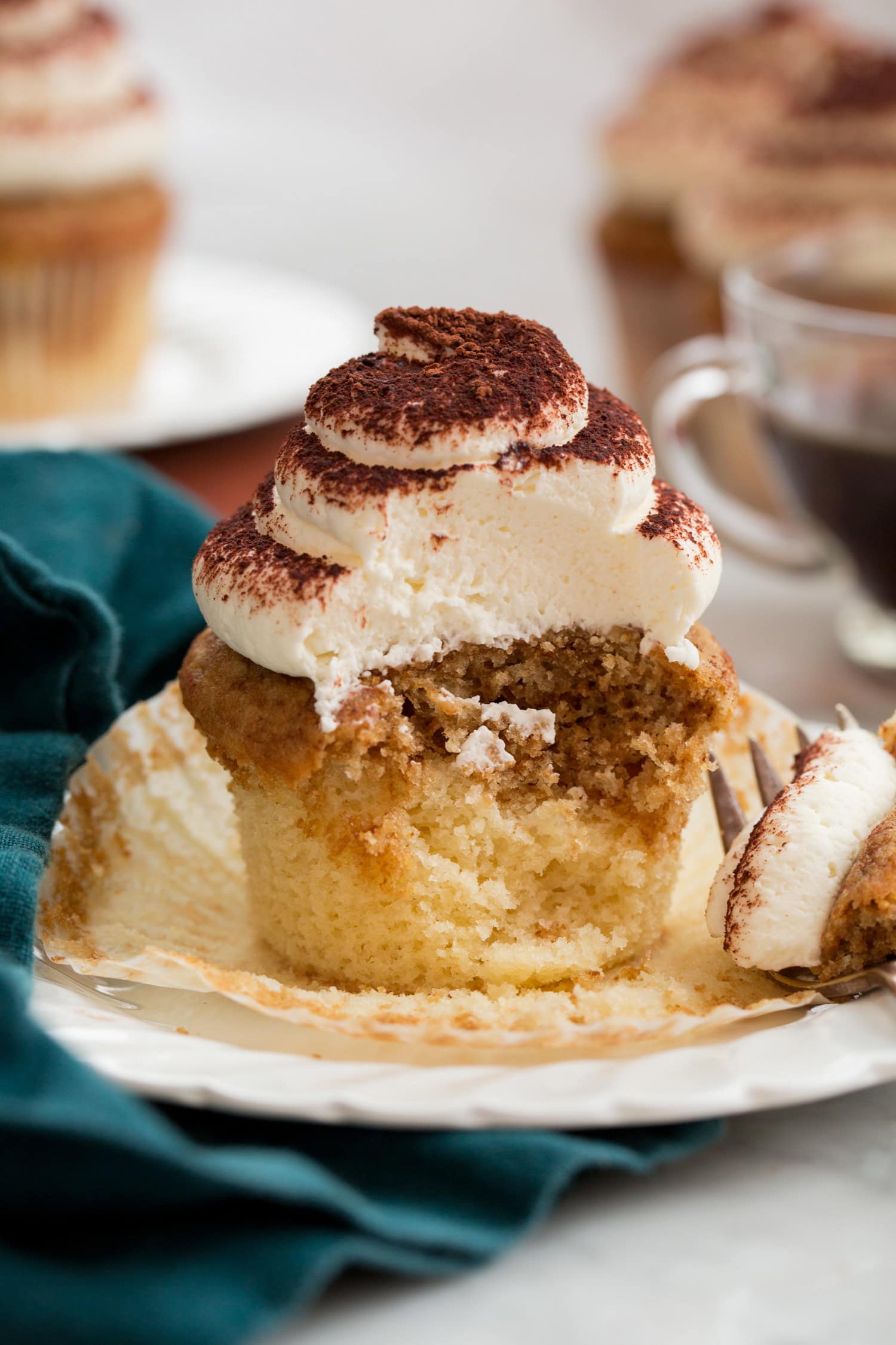Tiramisu cupakes Tiramisu Cupcakes cut into showing interior with soft moist crumb and two layers of flavors.