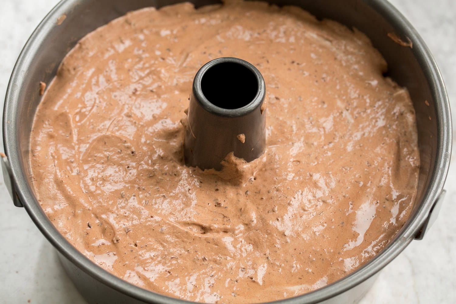 Chocolate Angel Food Cake Chocolate angel food cake batter in pan shown before baking.