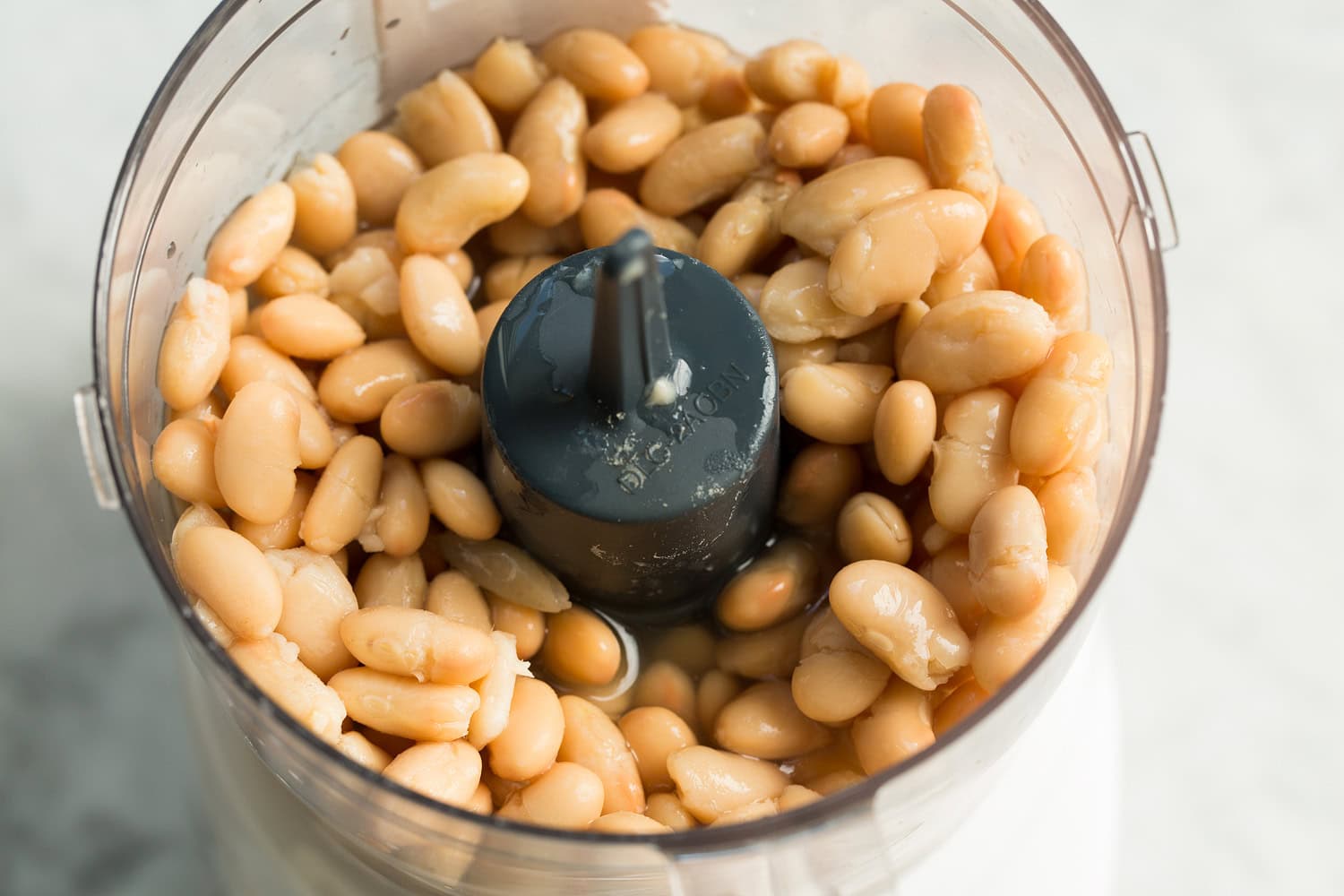 White Bean and Kale Soup White beans and broth in a food processor before pureeing.