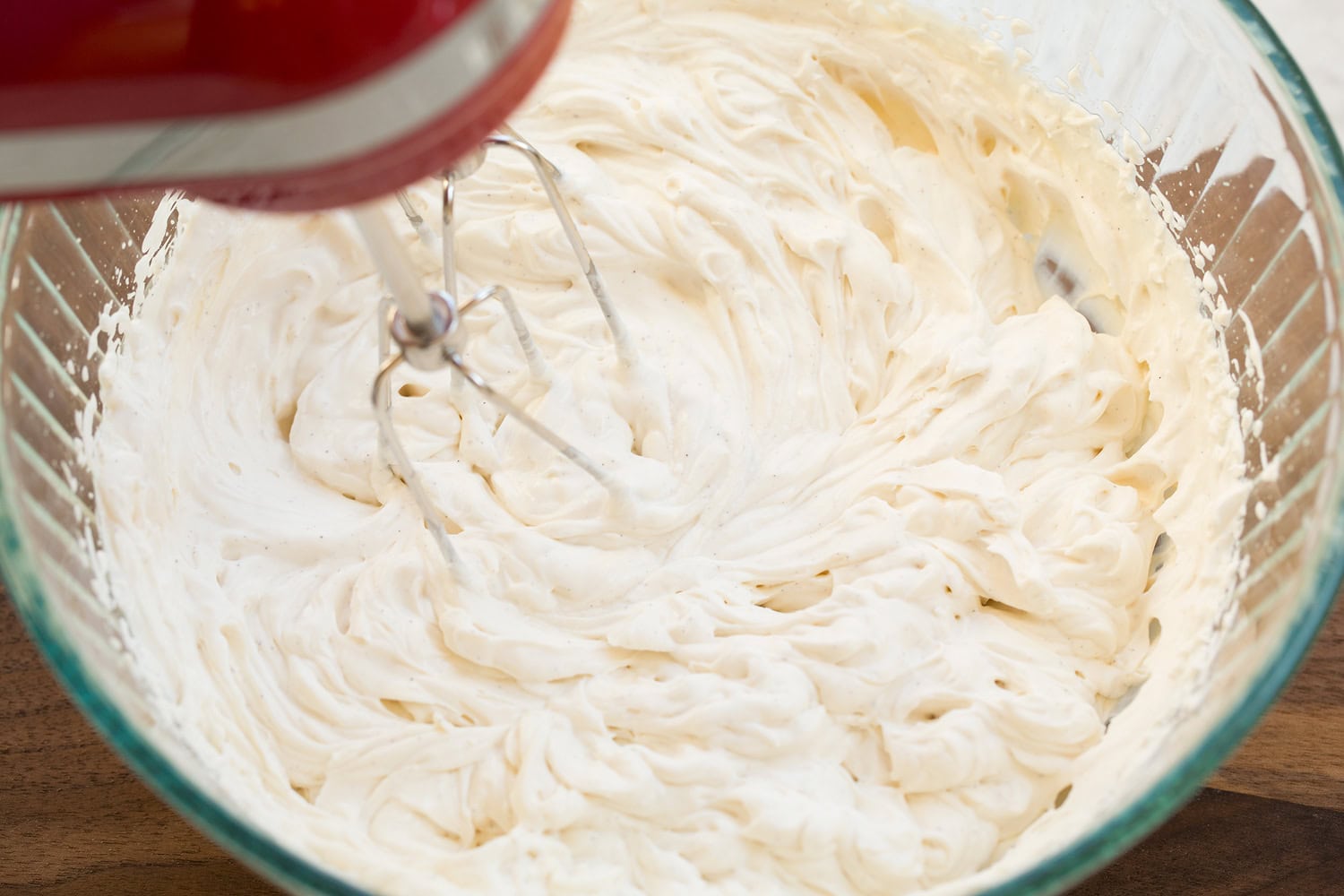 Whipped Yogurt Yogurt mixture after whipping with hand mixer in mixing bowl.