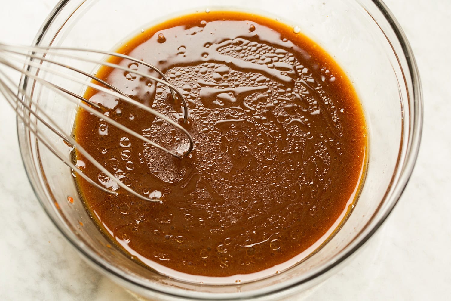 Stir fry noodle sauce mixed in a glass bowl.