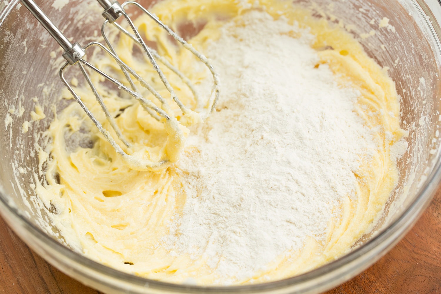 Tiramisu Cupcakes Flour mixture added to egg sugar mixture.