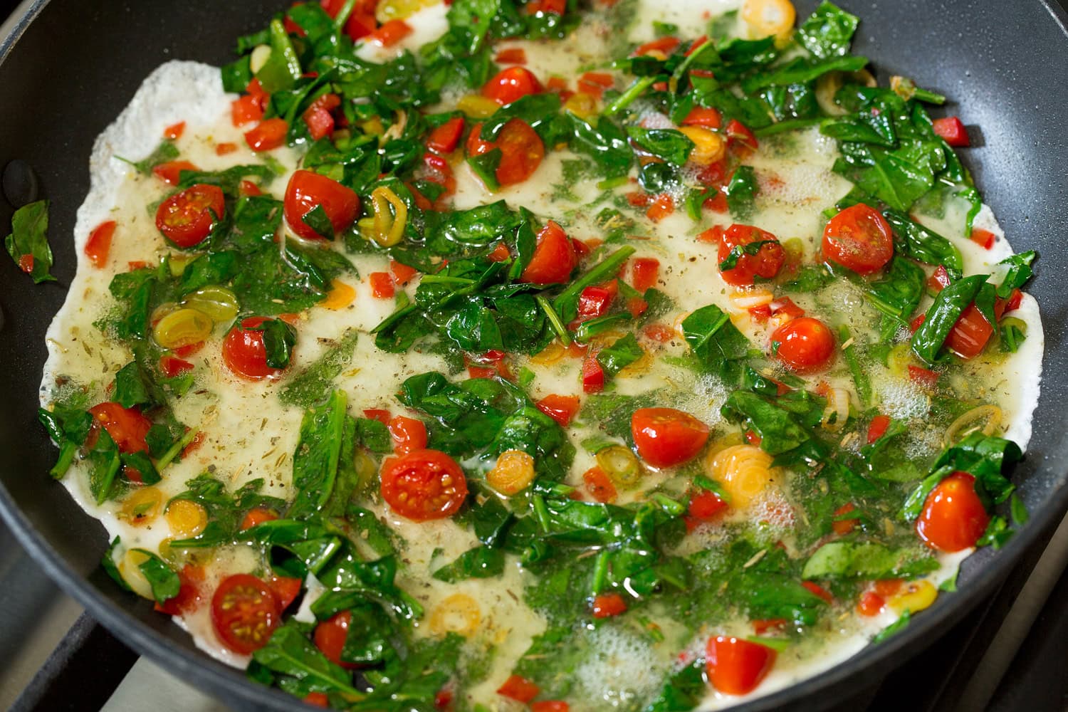 Egg White Omelette Egg whites added to sauteed veggies in skillet.