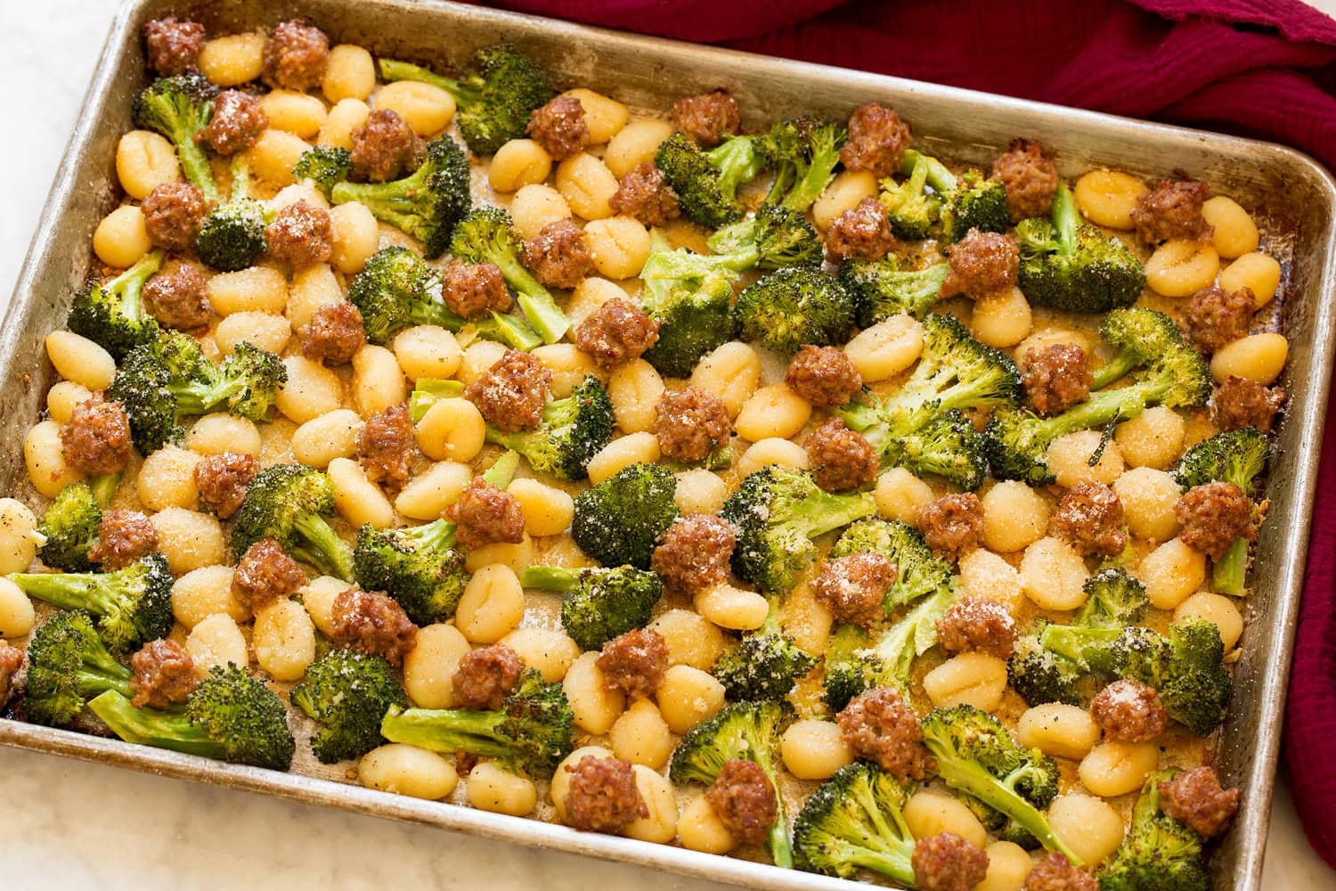 Completed gnocchi, sausage and broccoli shown after baking in oven.