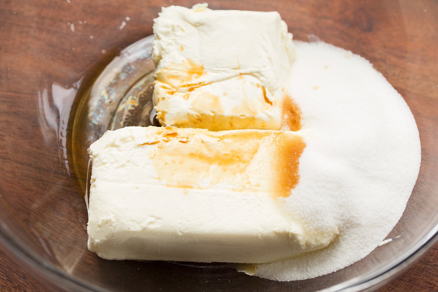 Strawberry Cheesecake Tiramisu Cream cheese, sugar and vanilla in glass mixing bowl.