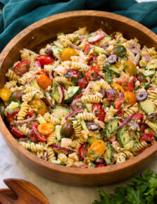 Tuna pasta salad in a wooden bowl.