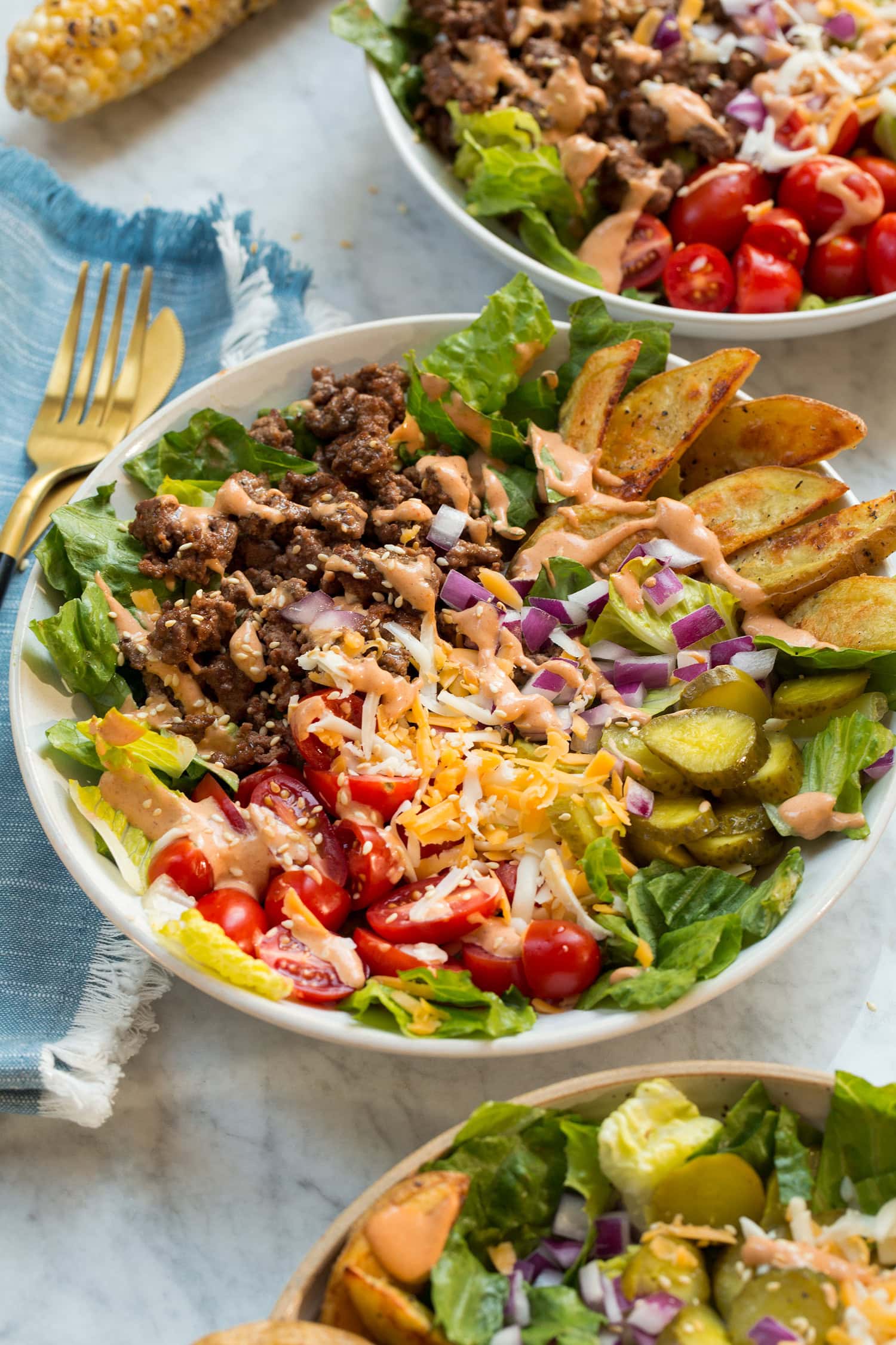 Burger Bowls Loaded burger bowls shown from the side.