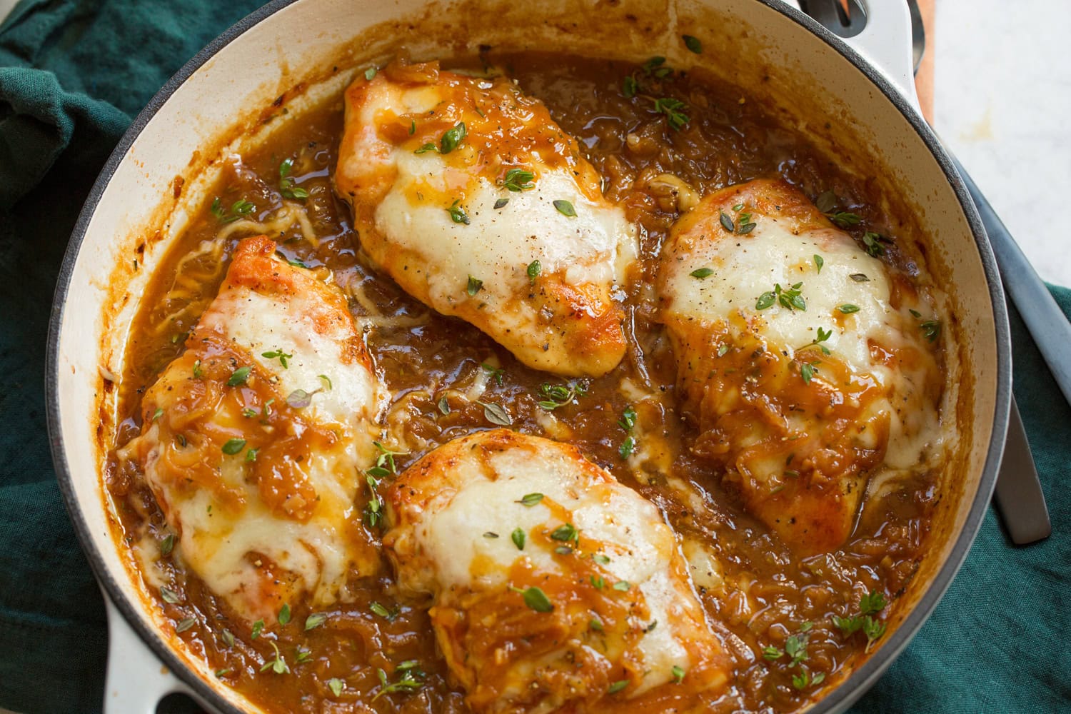French Onion Chicken Cheese shown after melting on chicken breasts.