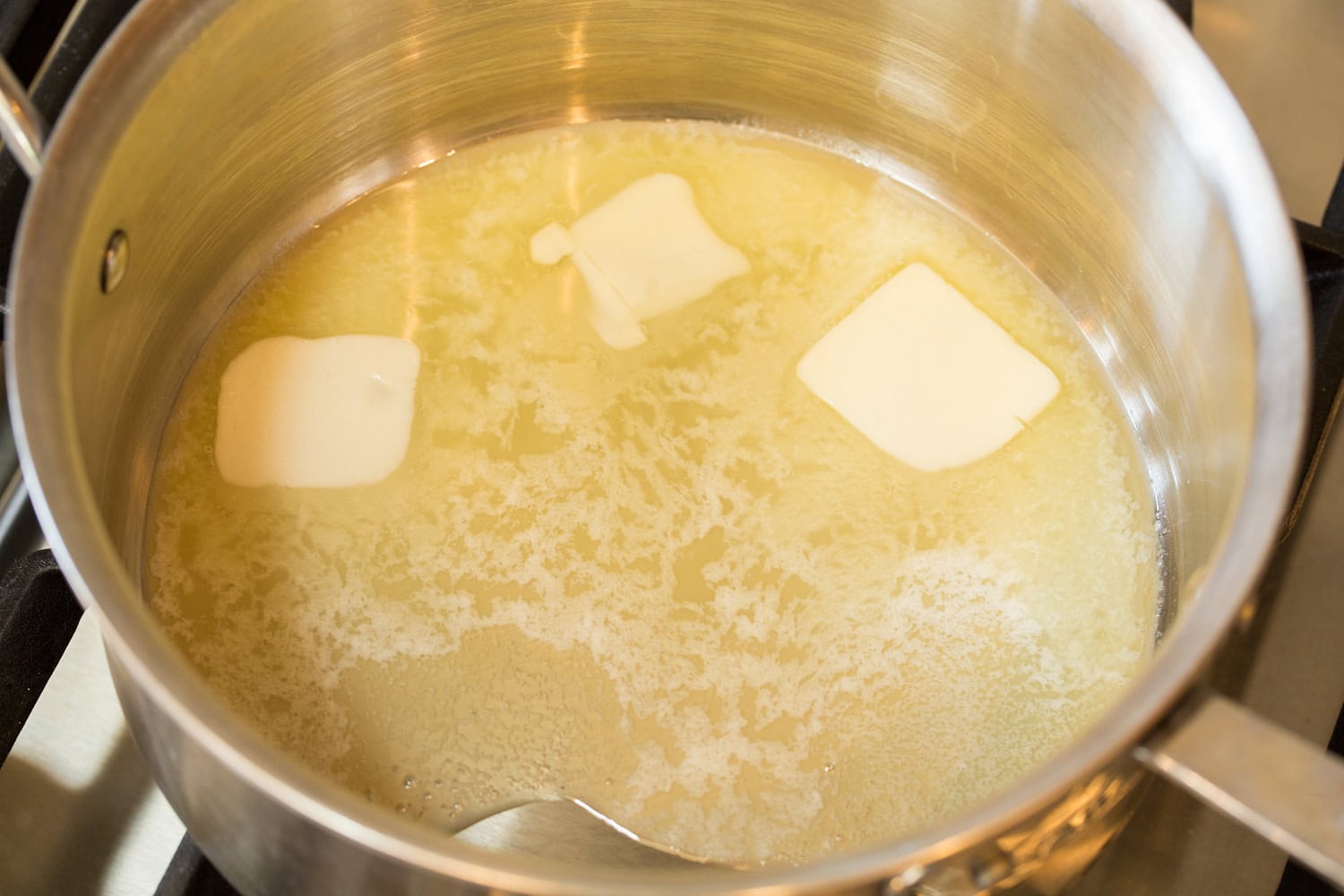 French Onion Chicken Melted butter in saucepan.