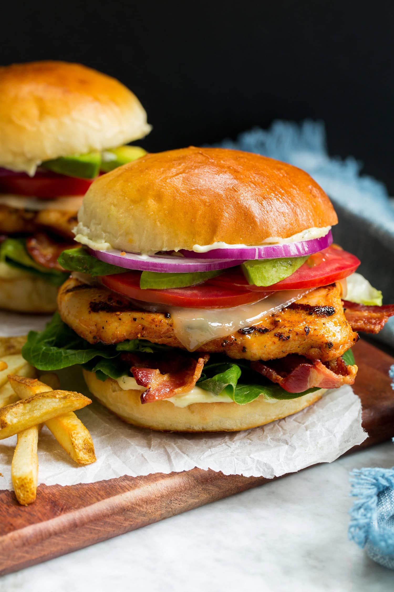 Grilled Chicken Sandwich Close up photo of grilled chicken sandwich on golden brown bun.