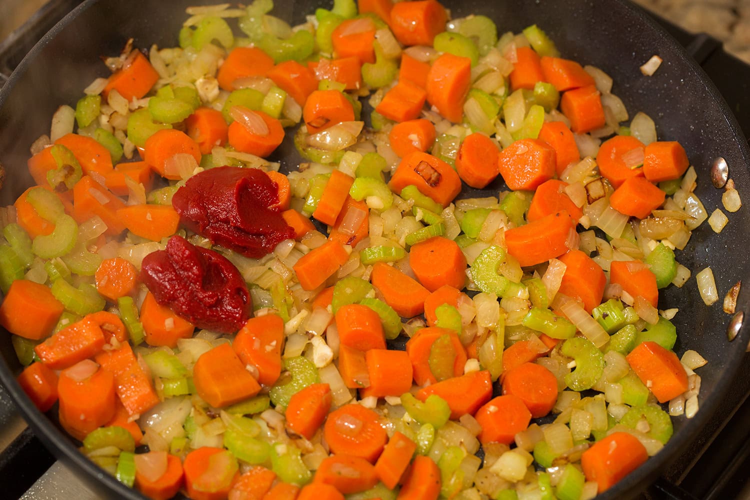 Slow Cooker Ground Beef Stew Tomato paste added to sautéed vegetable mixture.