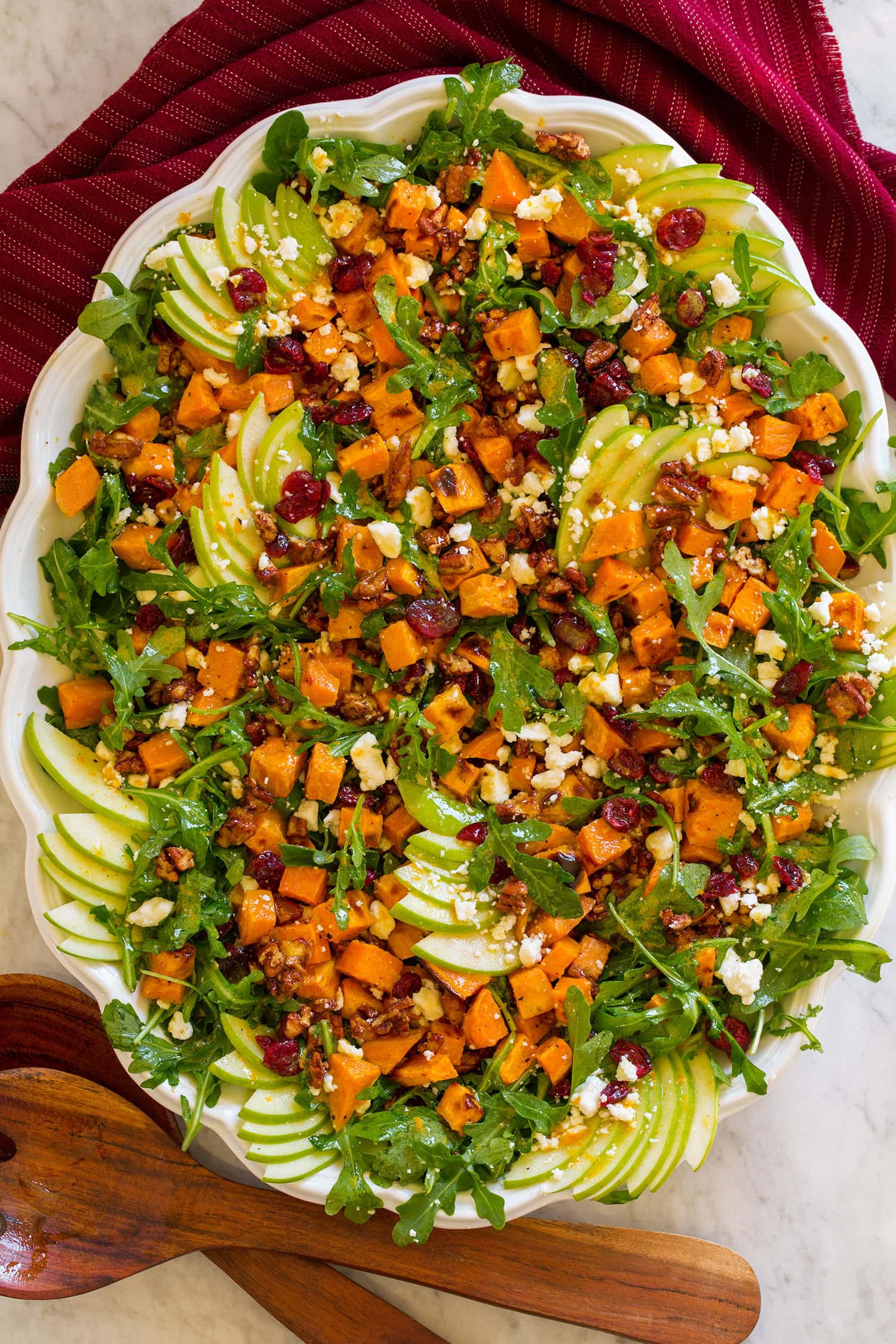 Sweet potato salad with arugula, roasted sweet potatoes, apples, maple pecans, feta and cranberries.