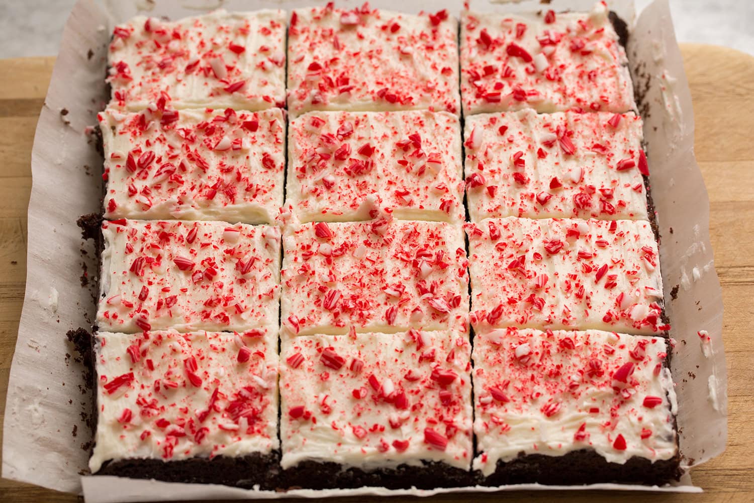 Completed brownies with crushed peppermint candies cut into squares.