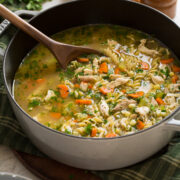 Pot filled with homemade turkey soup made from leftover turkey and carcass.