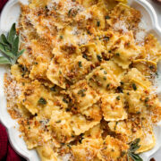 Browned butter sage sauce over ravioli pasta.