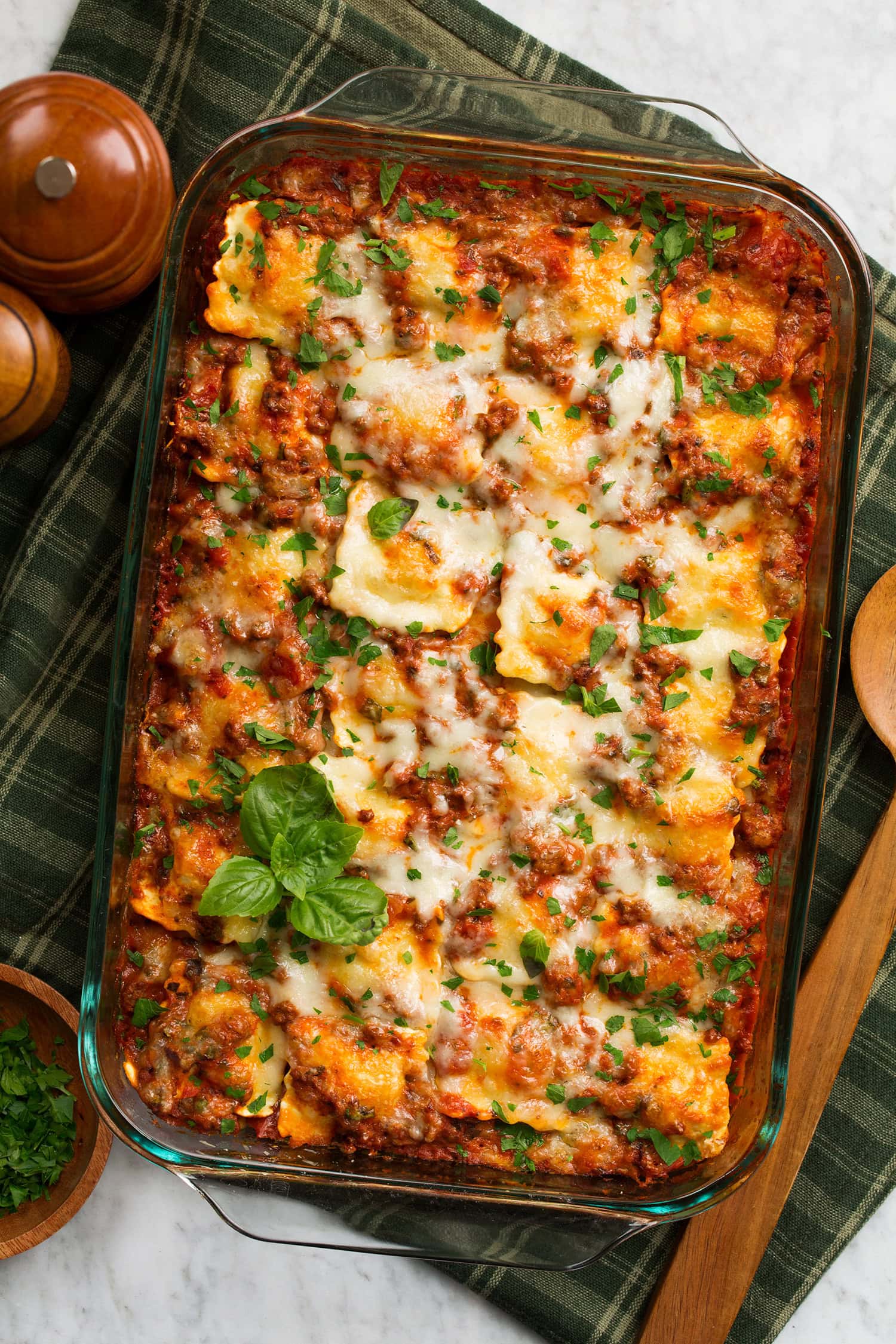Overhead photo of ravioli lasagna in a glass baking dish.
