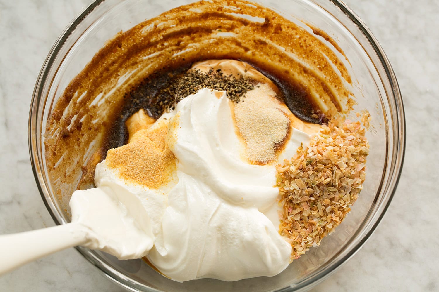 Dip ingredients shown before mixing in glass mixing bowl.