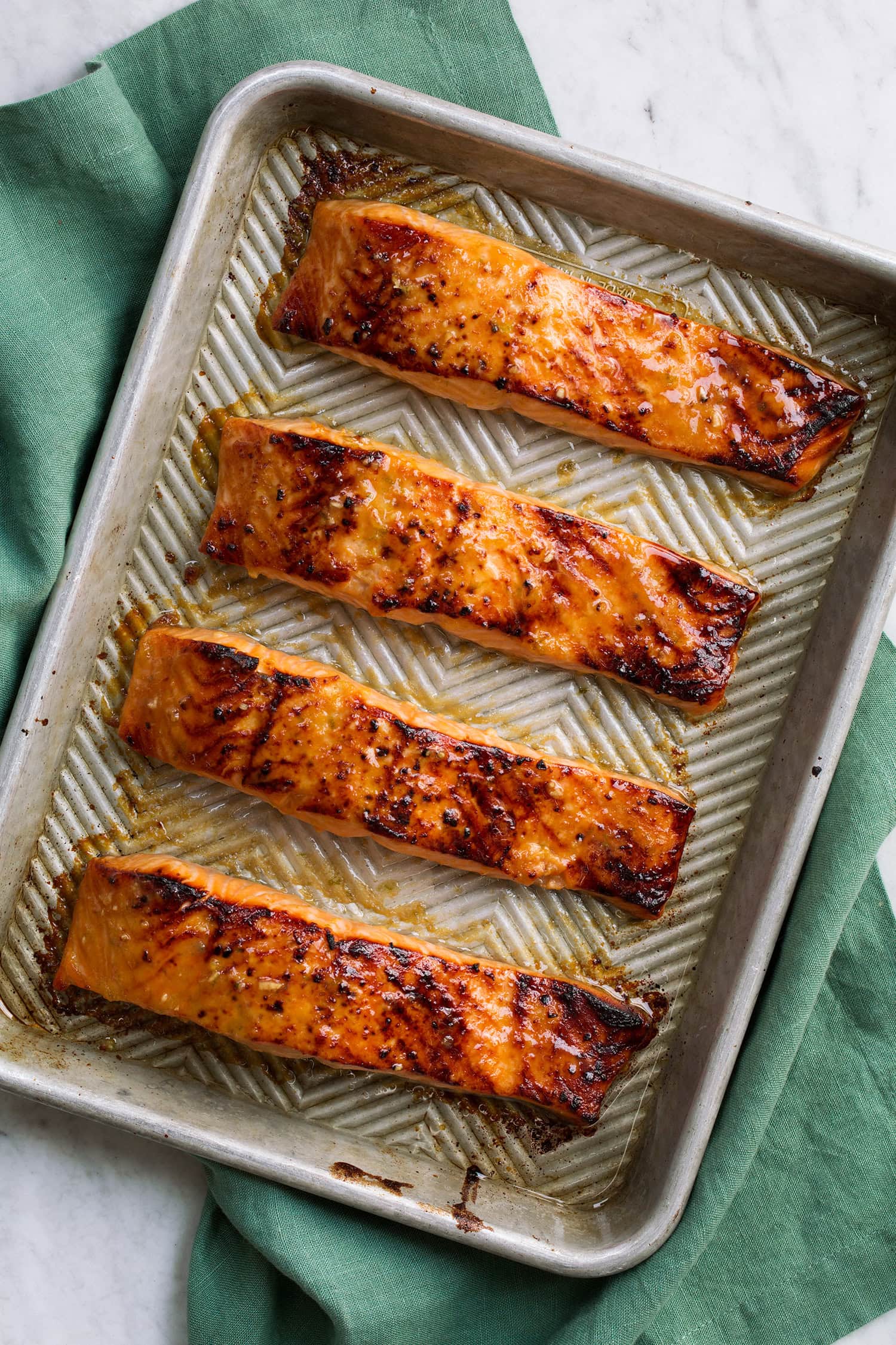 Overhead photo of miso salmon on baking sheet after broiling.