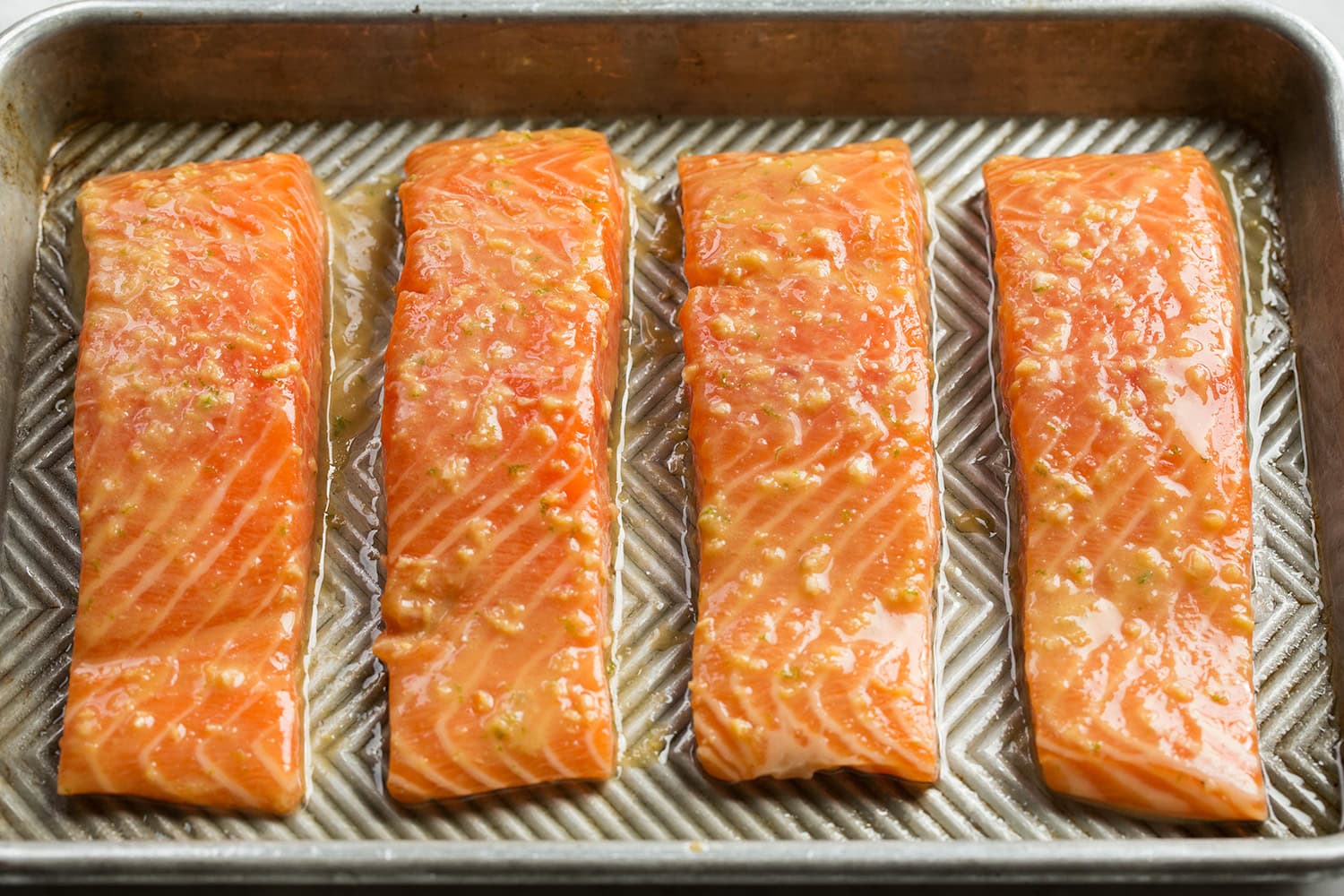 Raw salmon with miso glaze shown before baking.