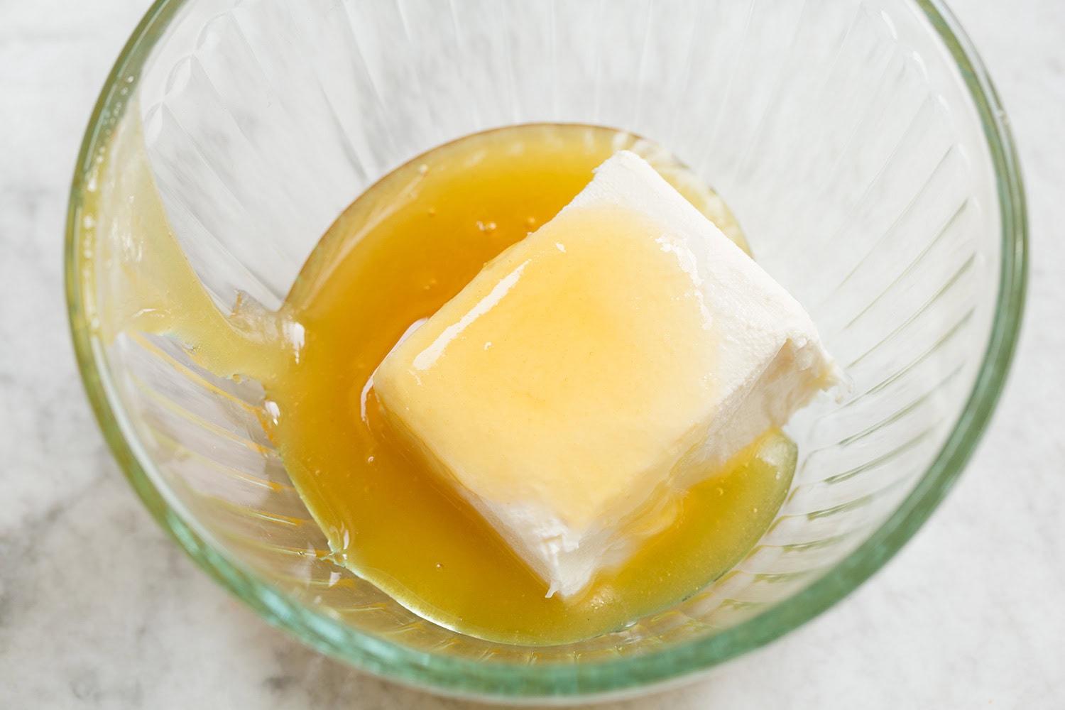 Cream cheese and honey in a small mixing bowl.