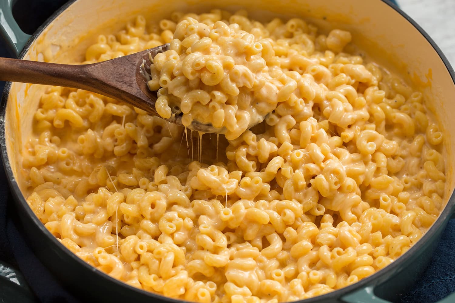 Completed cooked macaroni and cheese in pot.