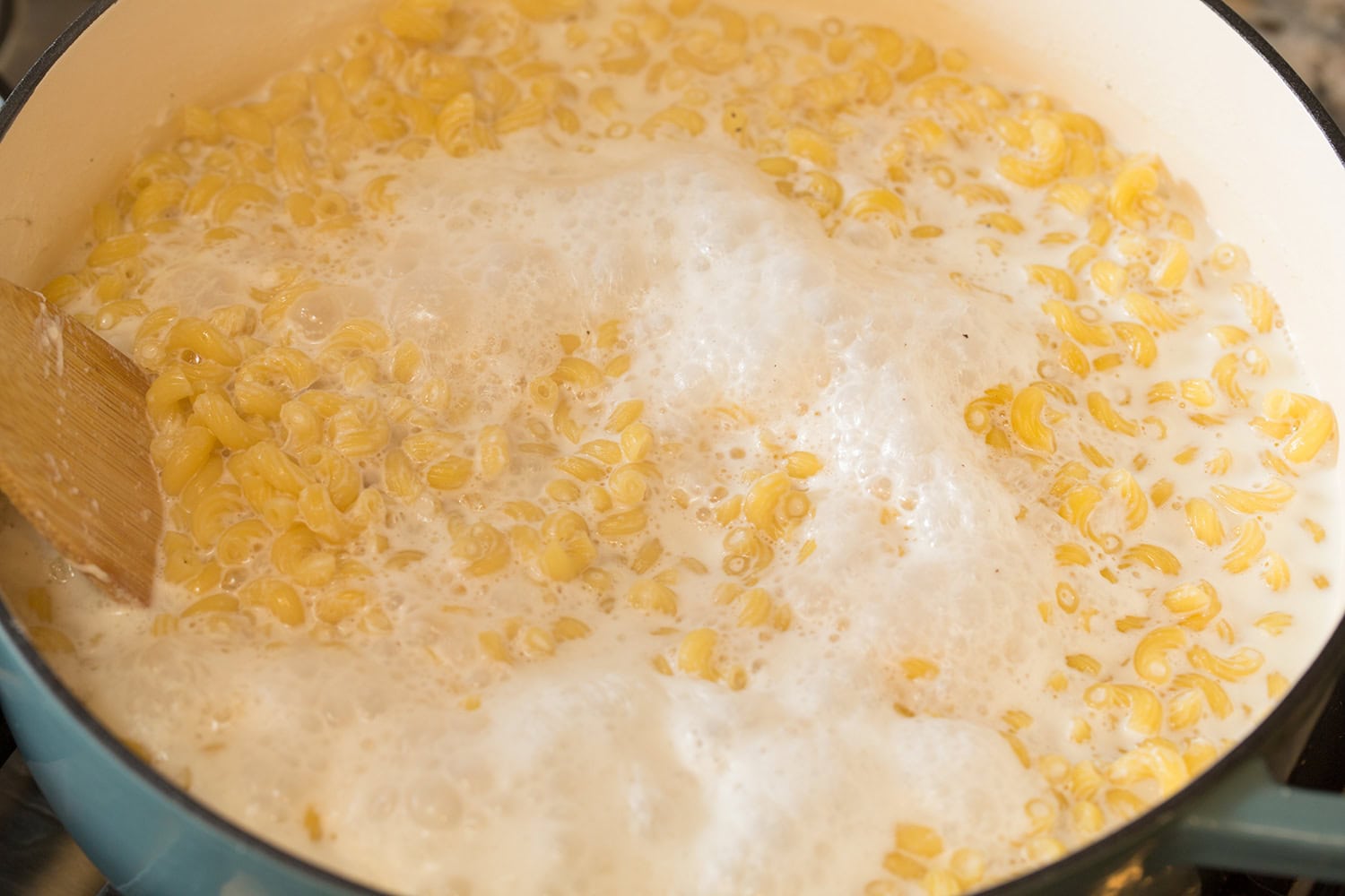Liquid shown reduced and pasta cooking.