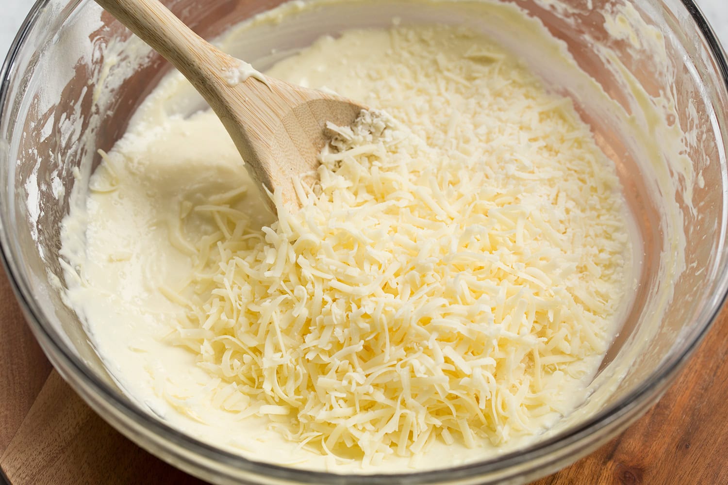 Shredded cheddar cheese and grana padano added to the dough.