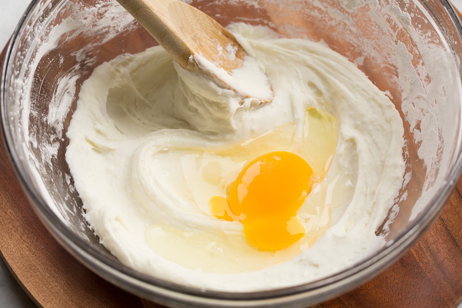 Brazilian Cheese Bread (Pão de Queijo) A cracked egg added to the tapioca flour milk mixture.