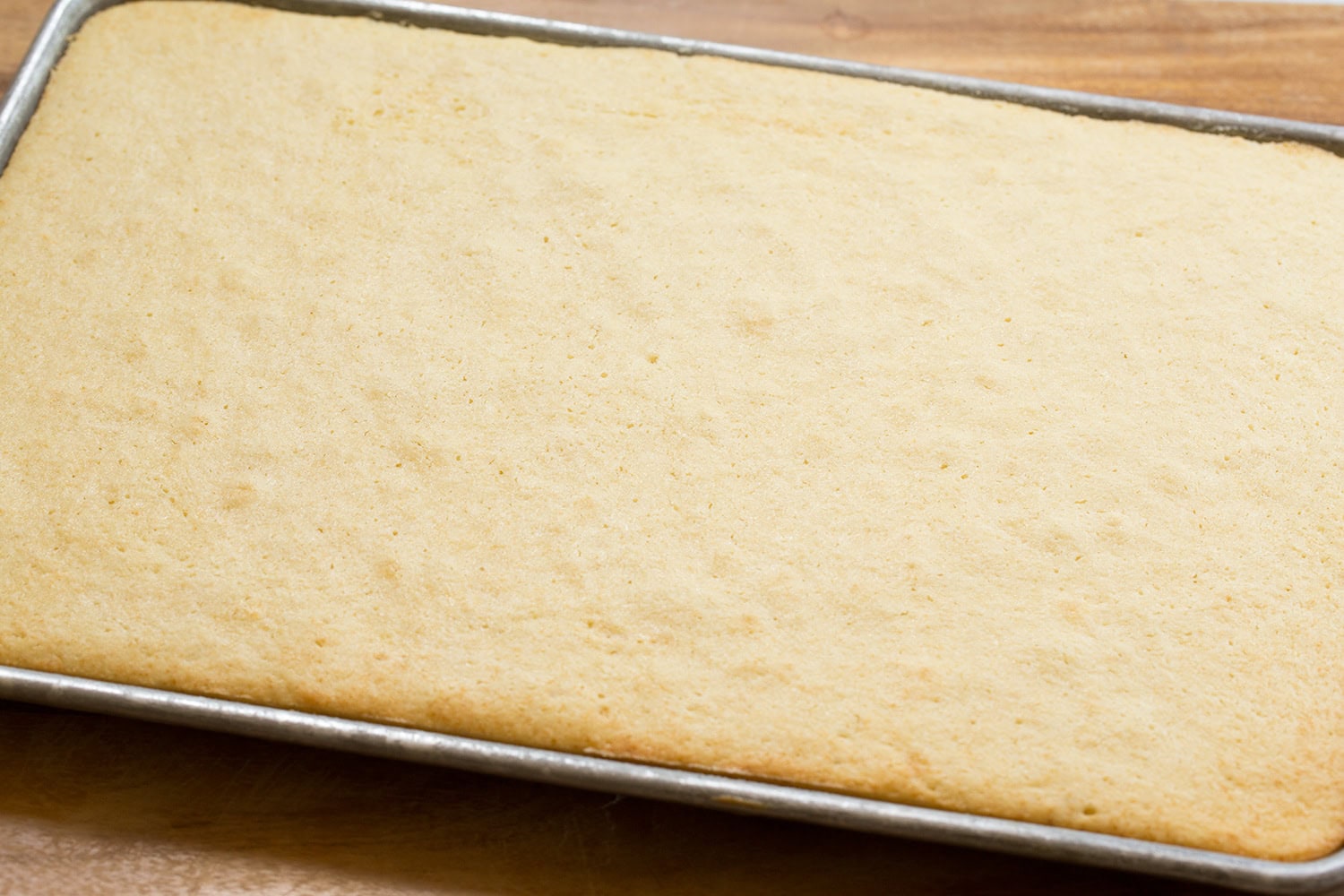 Baked vanilla sheet cake.