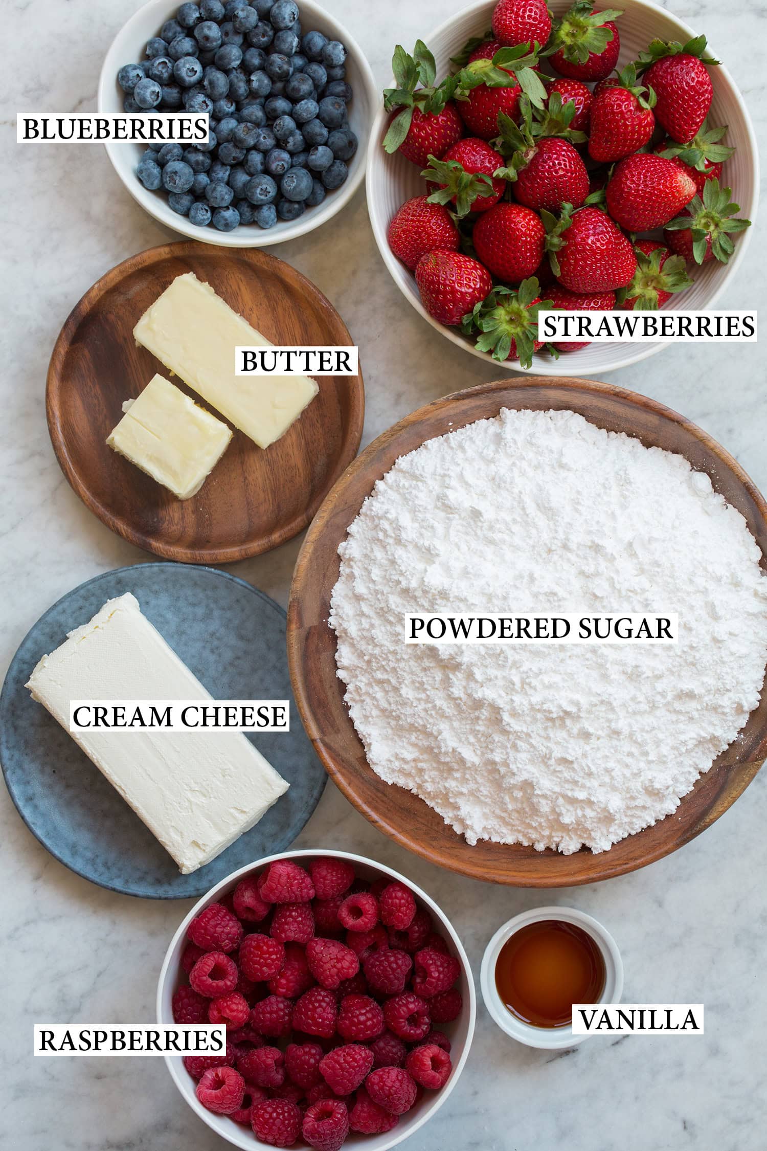 Ingredients used for the topping of an American flag cake.